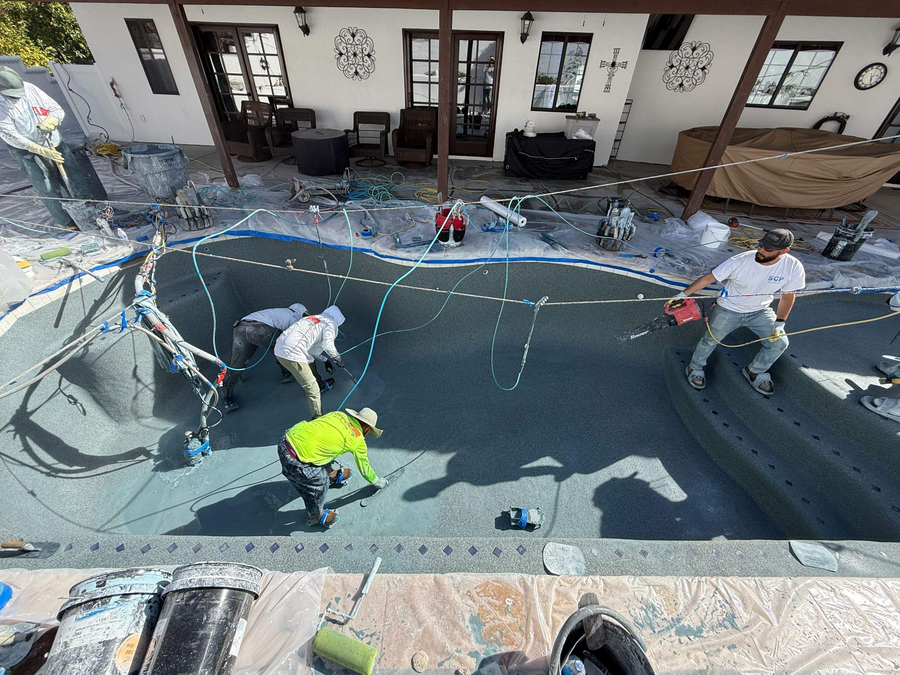 Pool and spa freeform travertine coping by Premier Pools and Spas Temecula