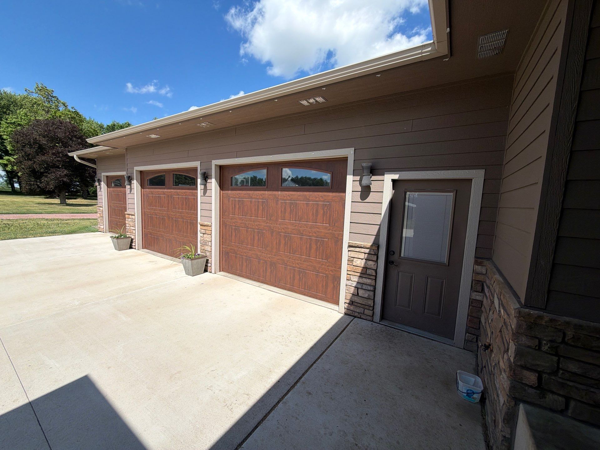 Full Exterior Siding Paint Restoration and Refresh in Garretson by Select Painting, Coatings & Garage Cabinets