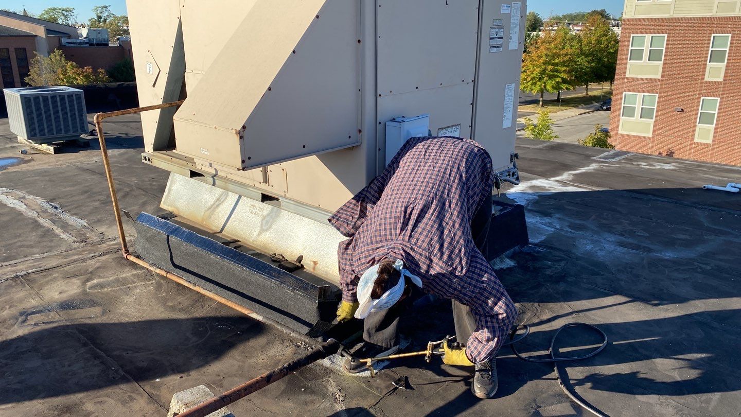 Commercial Roofing Repair using new Flashing by Alpha Design Services