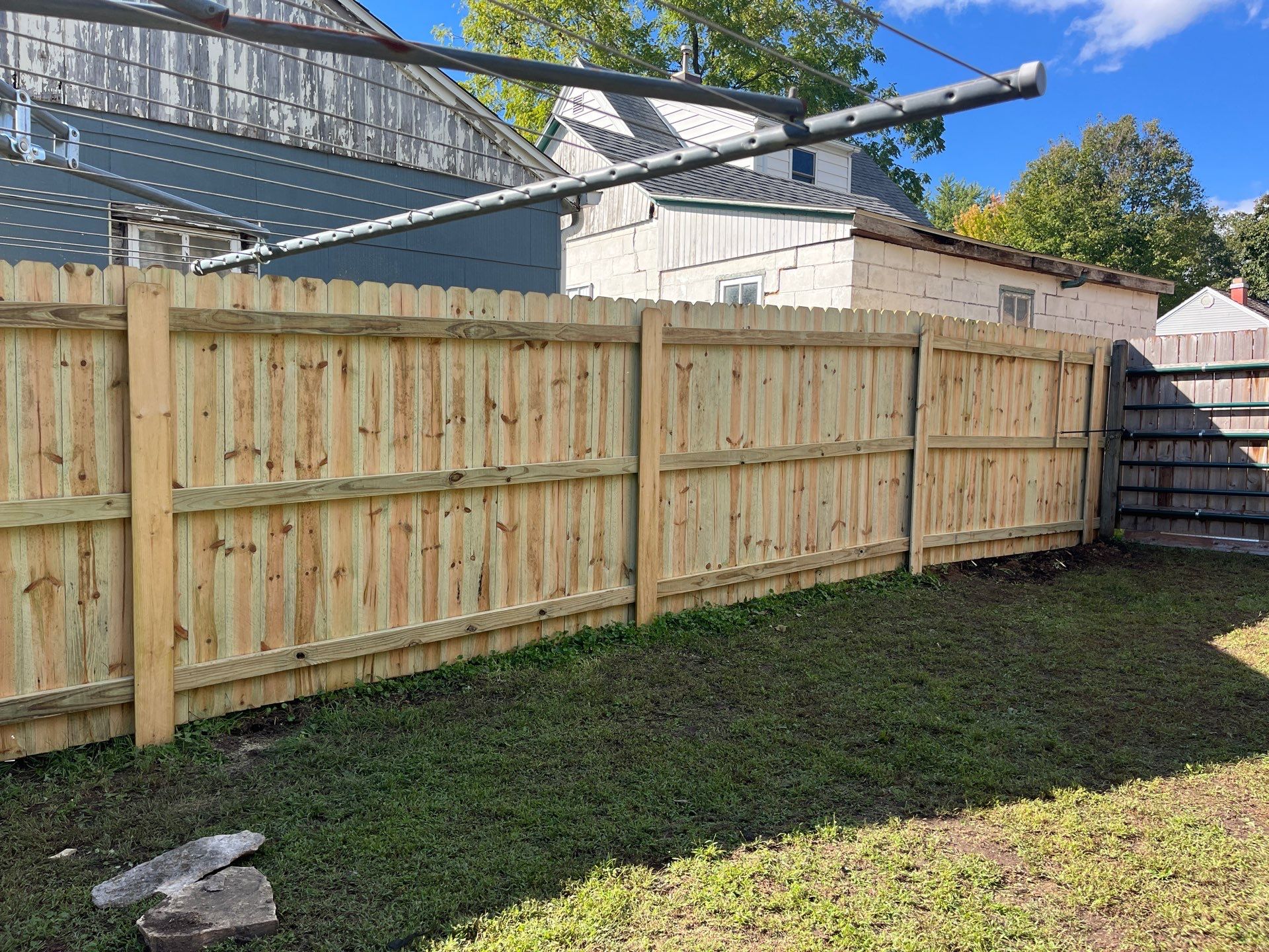 Pressure-Treated Wood Privacy Fence Installation in Waverly, Iowa by Perfect Picket Fence and Stain