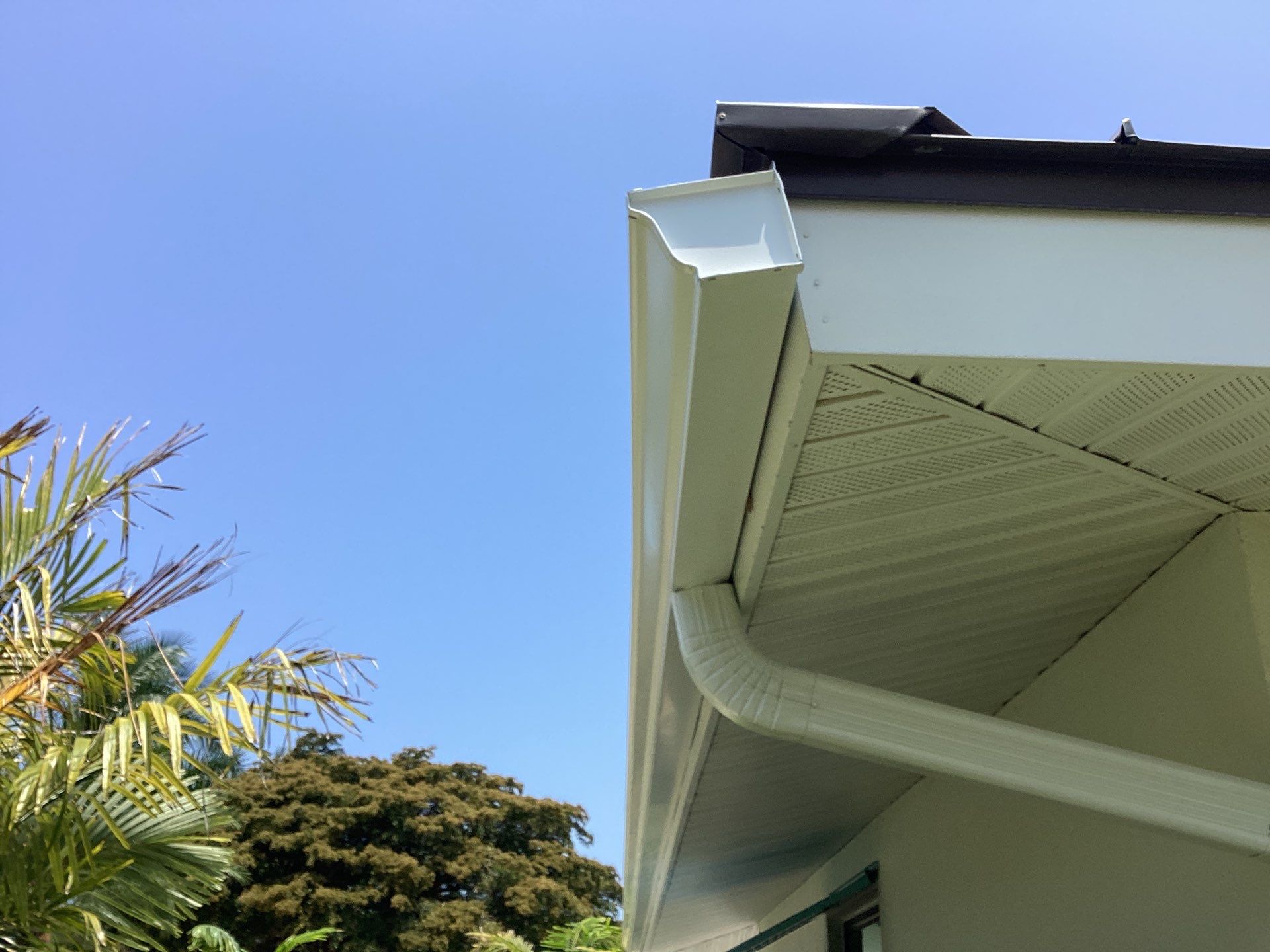 White Seamless Gutters and Downspouts in Sarasota FL by Gutter Professors