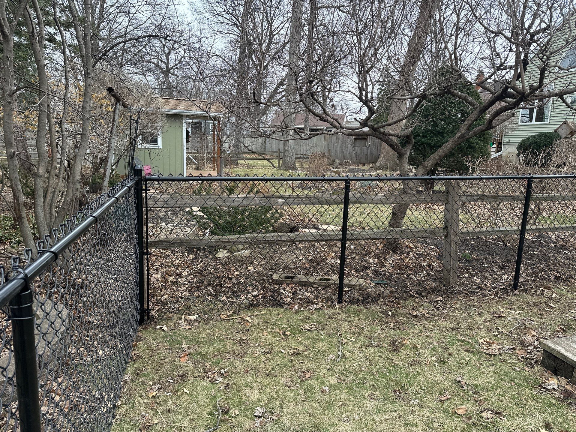 Black Vinyl Chain Link Fence Installation in Cedar Falls by Perfect Picket Fence and Stain