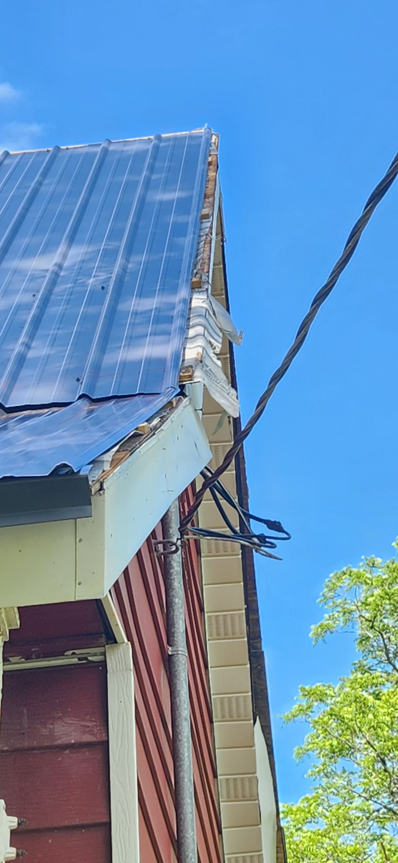 Residential Roofing Installation using 26 Gauge Colored Panels by Hostetler Roofing