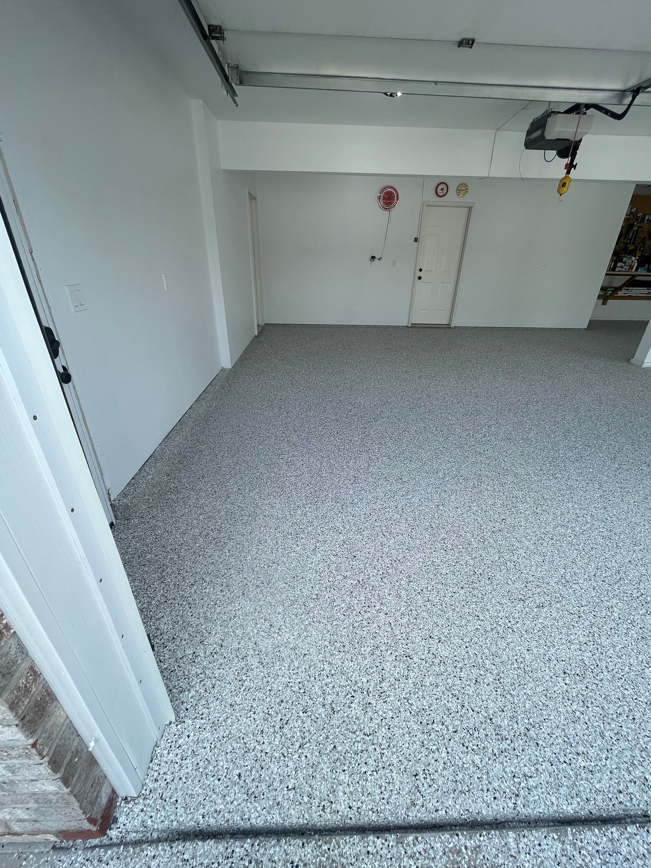 Multi-Car Garage Concrete Coating with Coyote Flake Finish in Sioux Falls by Select Painting, Coatings & Garage Cabinets