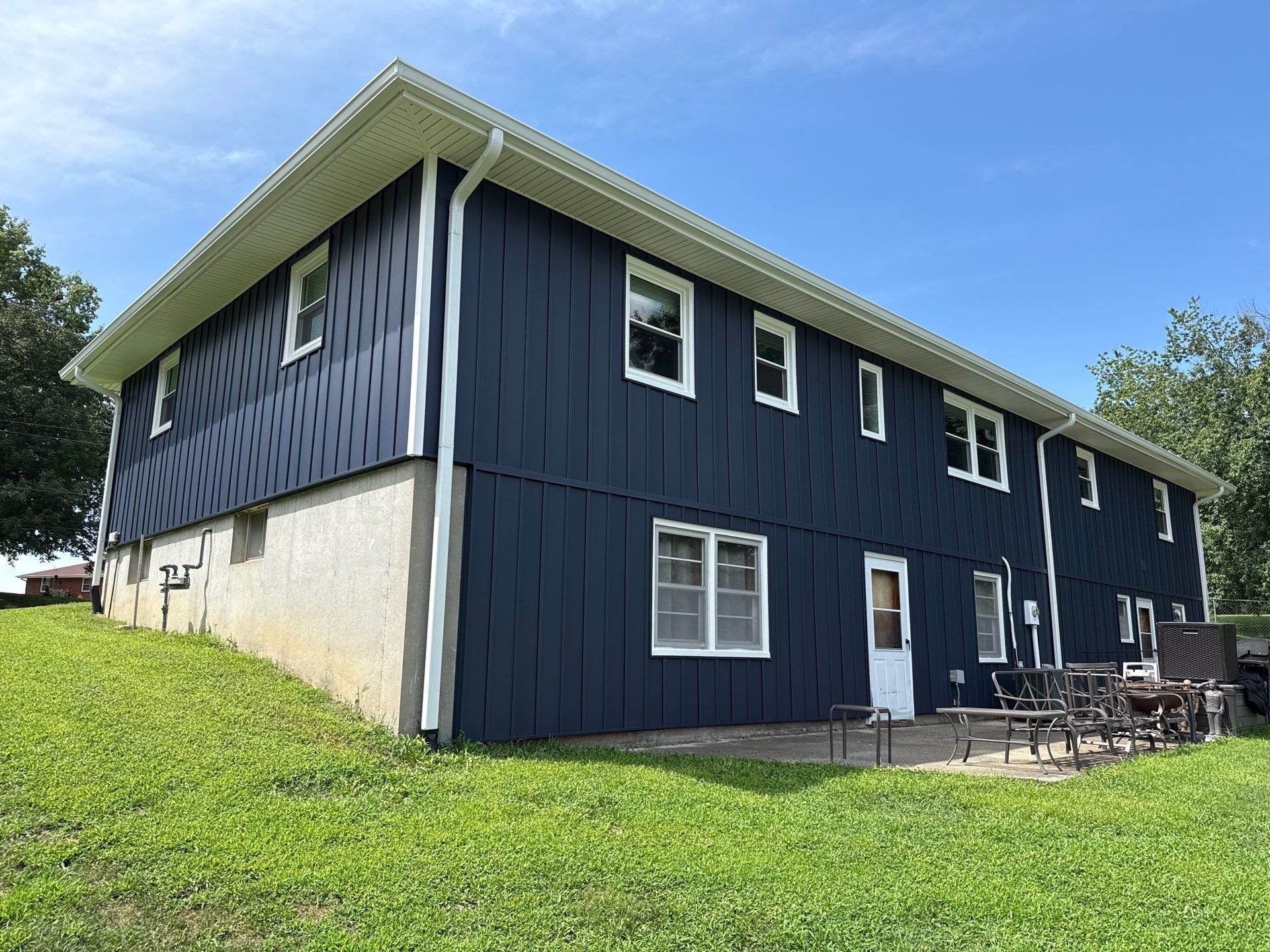 Indigo Board and Batten Siding and Window Replacement in Smithville by EEC Windows, Siding & Roofing