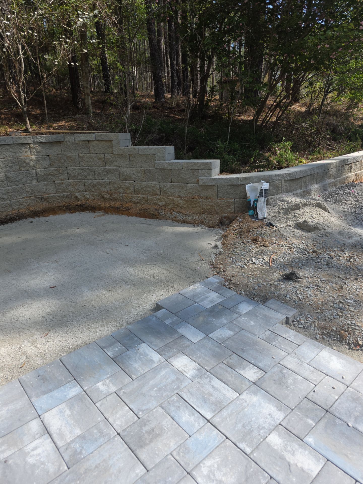 Pittsboro Outdoor Living Transformation – Retaining Wall, Paver Patio & Elevated Deck by Elite Remodeling and Design LLC