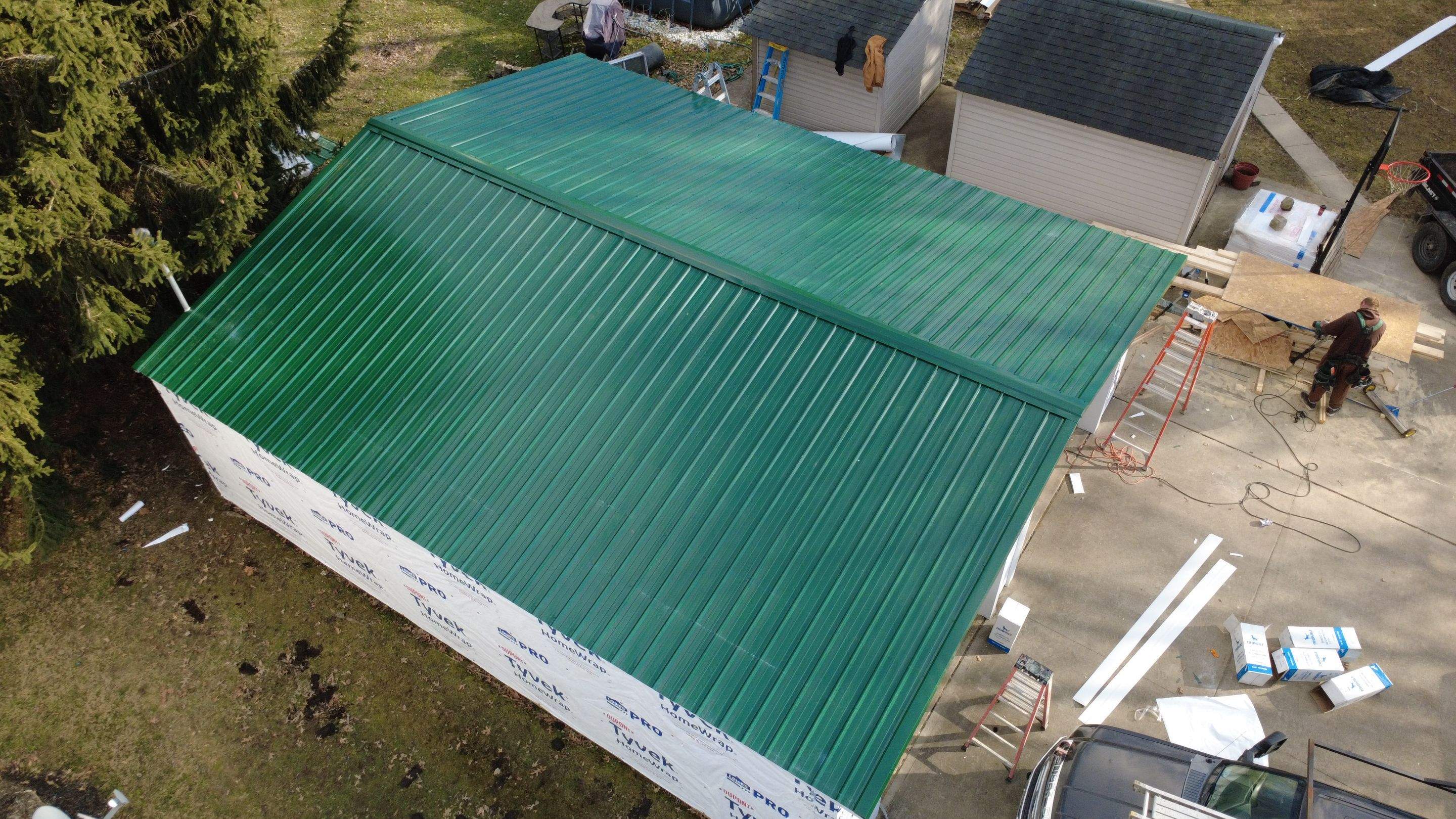 Green Metal Roof Installation and Exterior Renovation in Thornville by Canopy Contracting