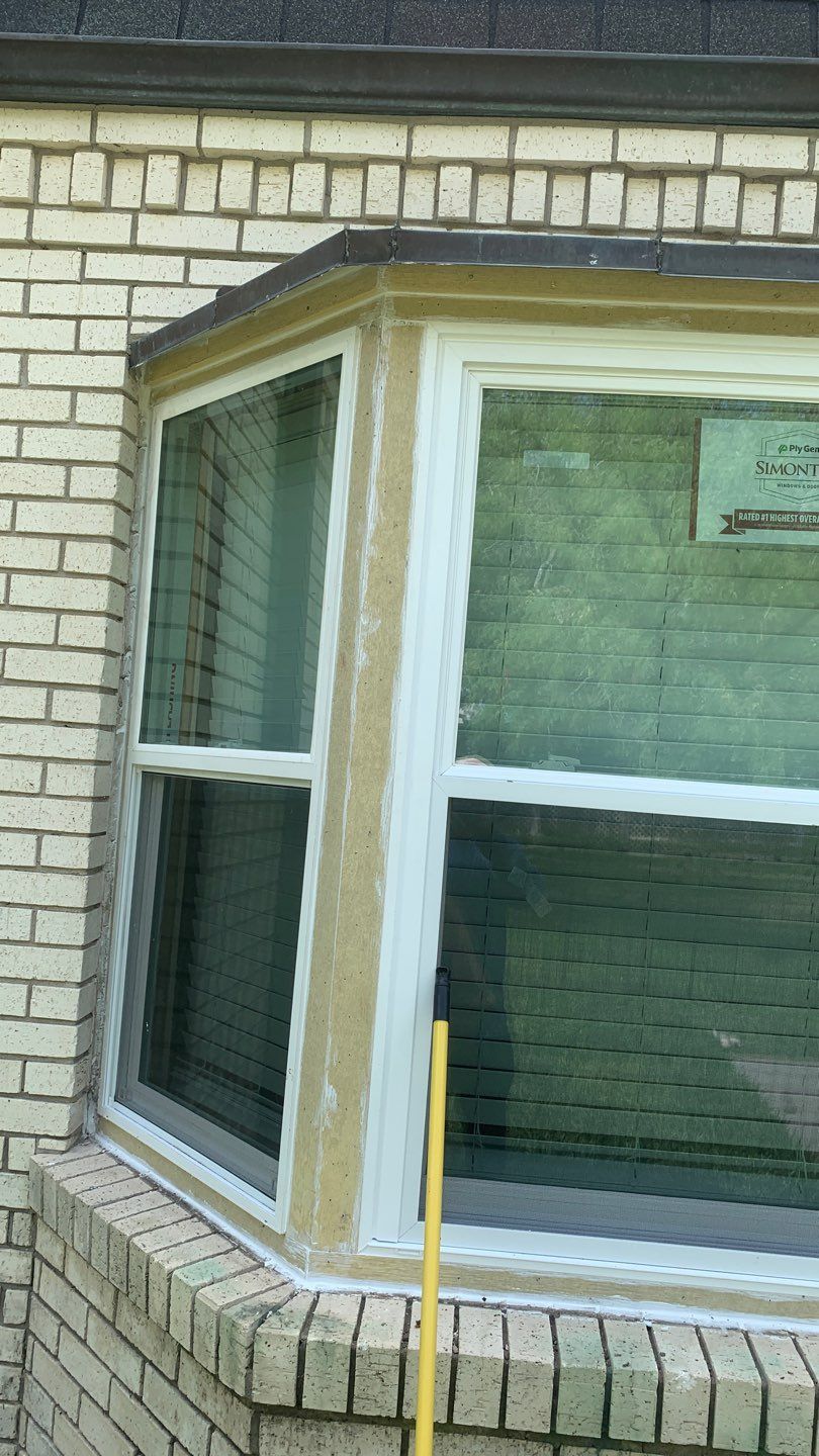 Mansard Charm by Bayfront Roofing and Construction