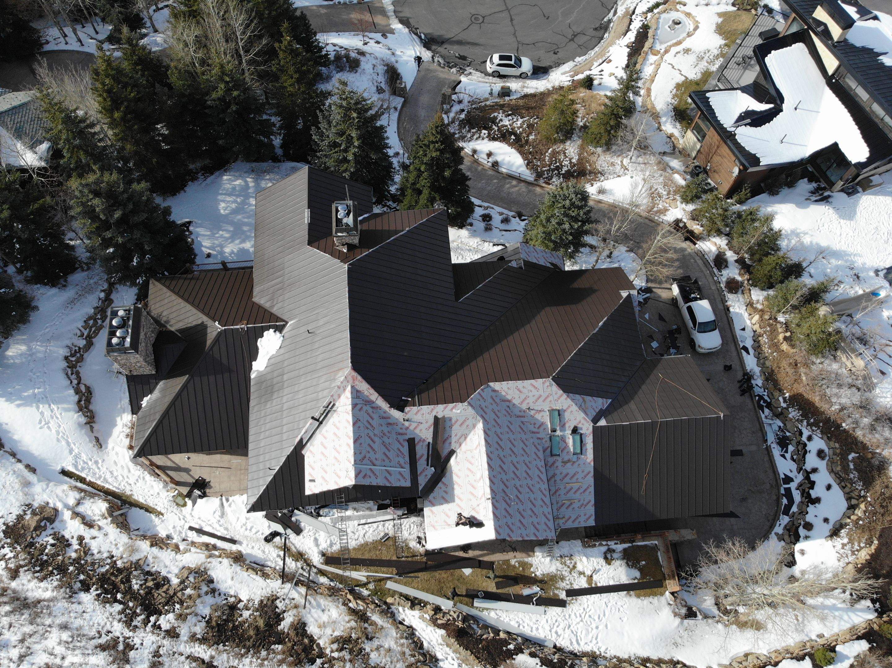 Standing Seam Metal Roof Replacement After Snow Damage by ASAP Roofing & Restoration