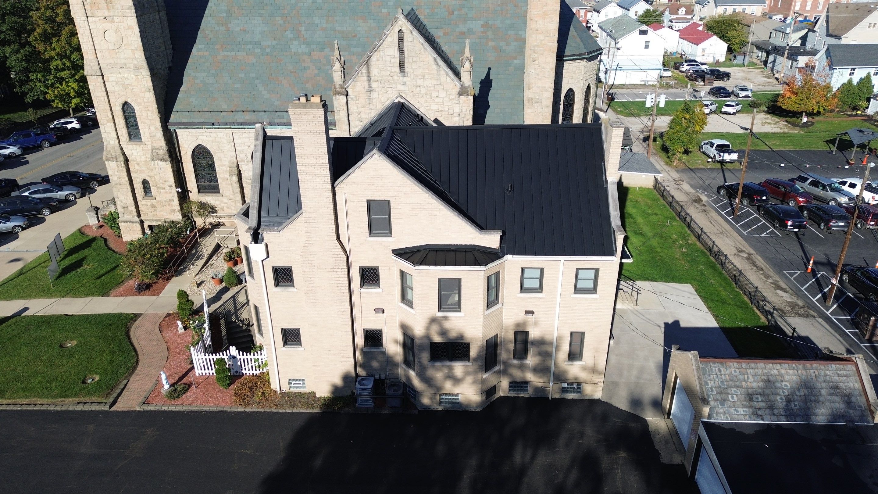 Commercial Roofing Installation using Standing Seam Metal - Frost Black by RoofX 