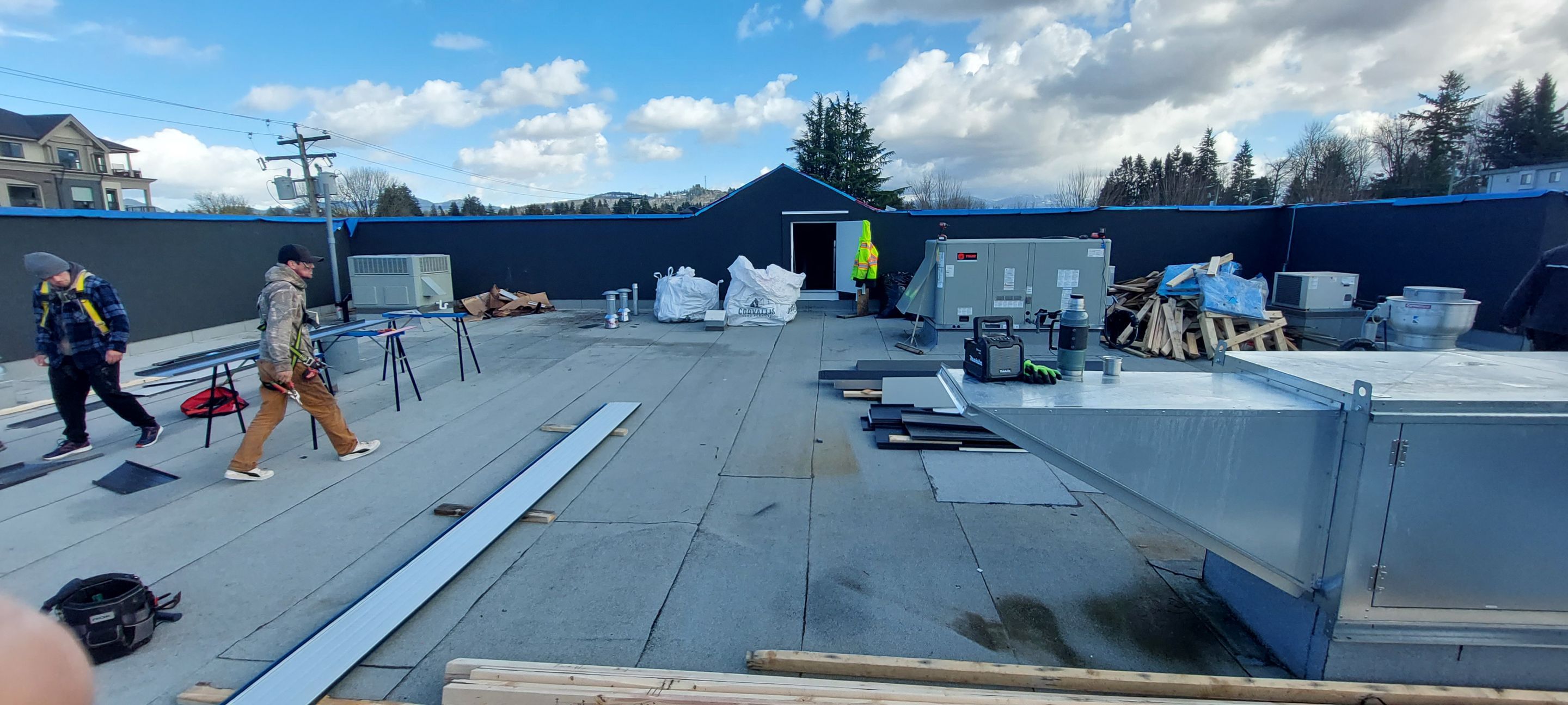 Commercial Roofing Installation using 12" Prolok metal and hidden gutters! by Top Notch Roofing Inc