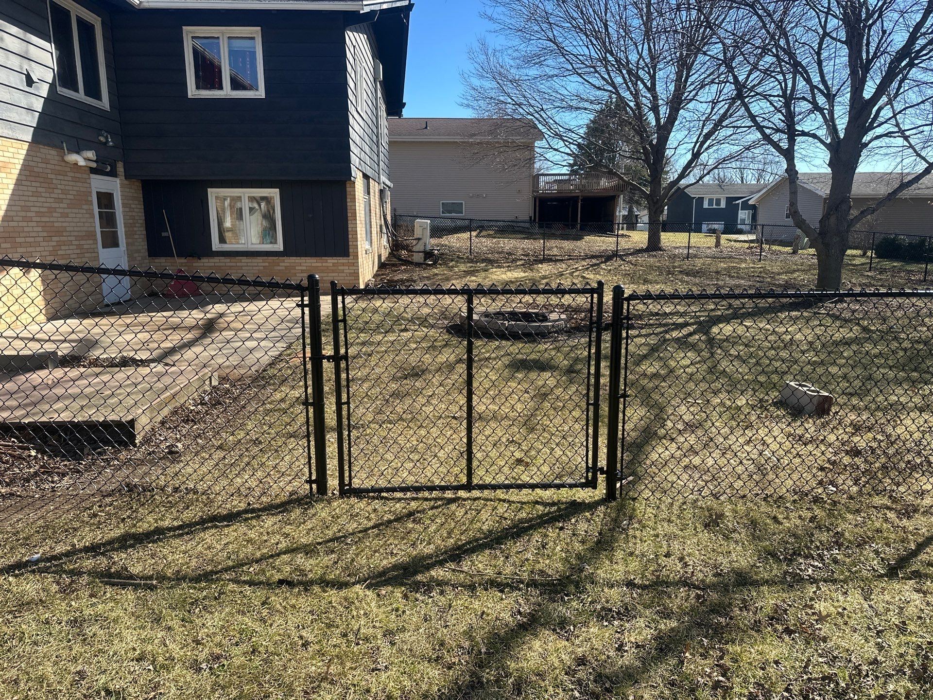 Black Chain Link Fence Installation with Double Gate in Grundy Center by Perfect Picket Fence and Stain