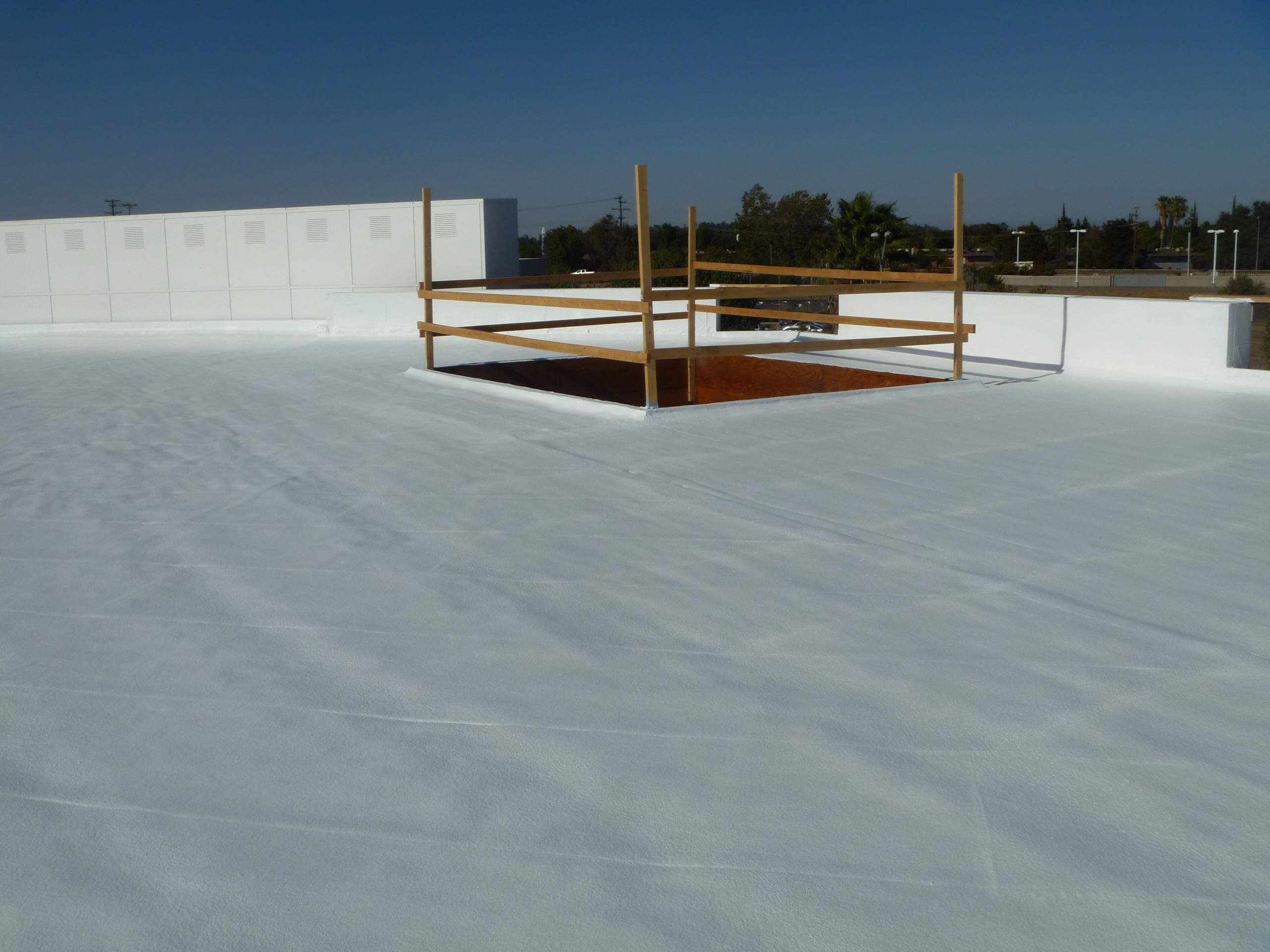 Commercial Roofing Installation using Spray foam and Conklin Benchmark/PUMA XL 18 yr warranty coatings by Straight Edge Roofing Inc