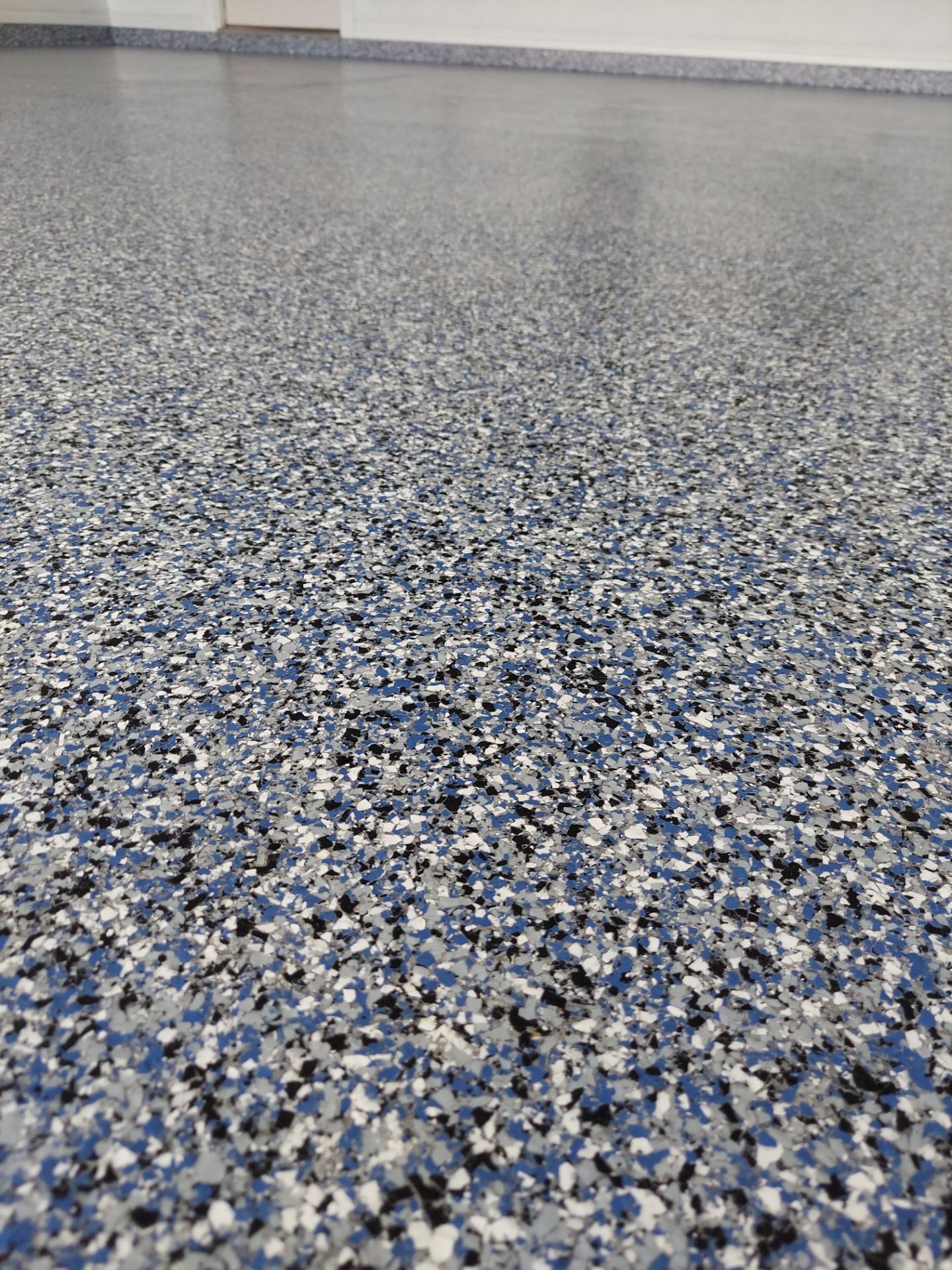 Garage Floor Coating w/ Orbit/Denim by Copperhead Coatings
