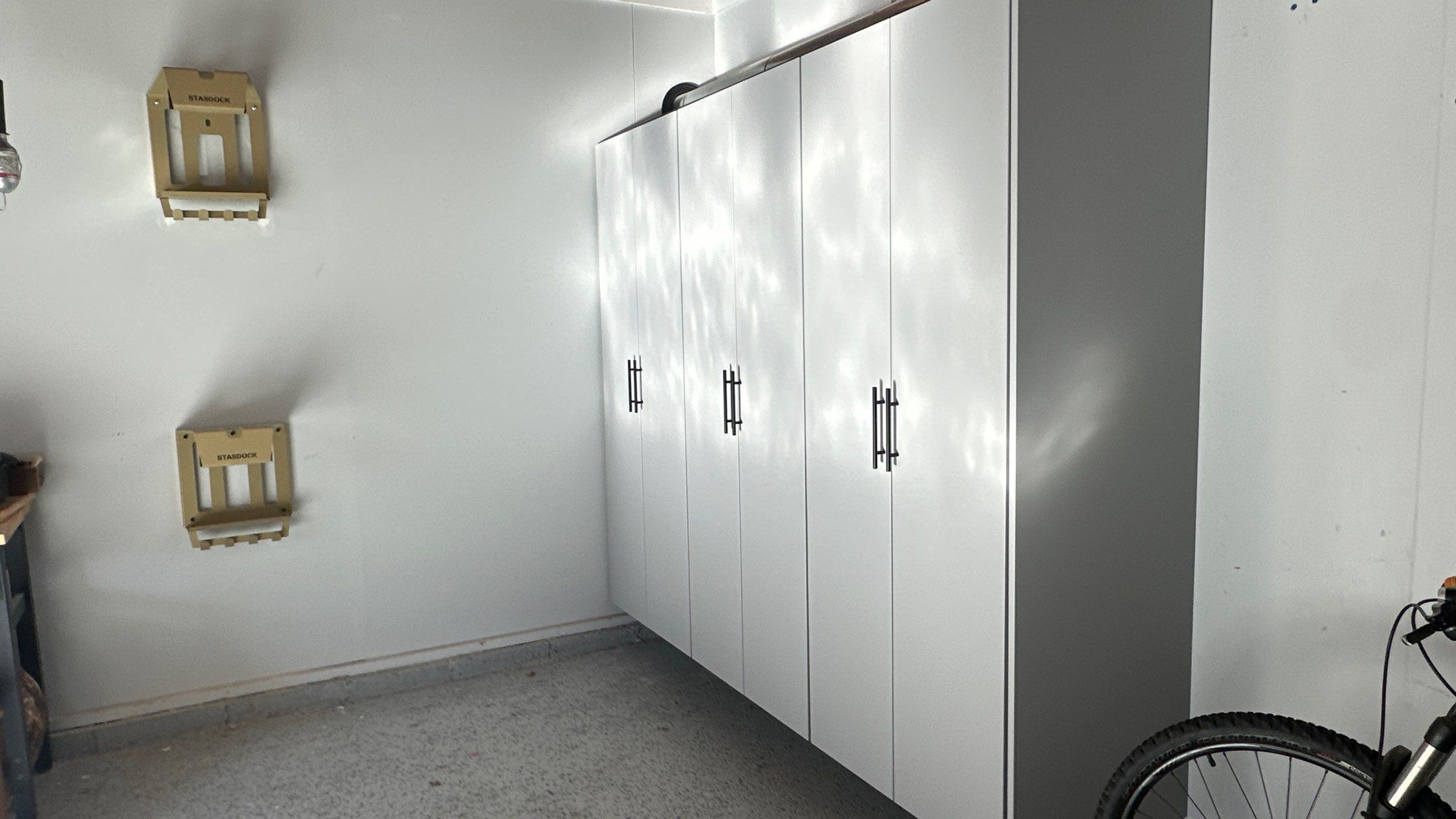 Jamie N added these beautiful cabinets for extra storage space by Banner Garage