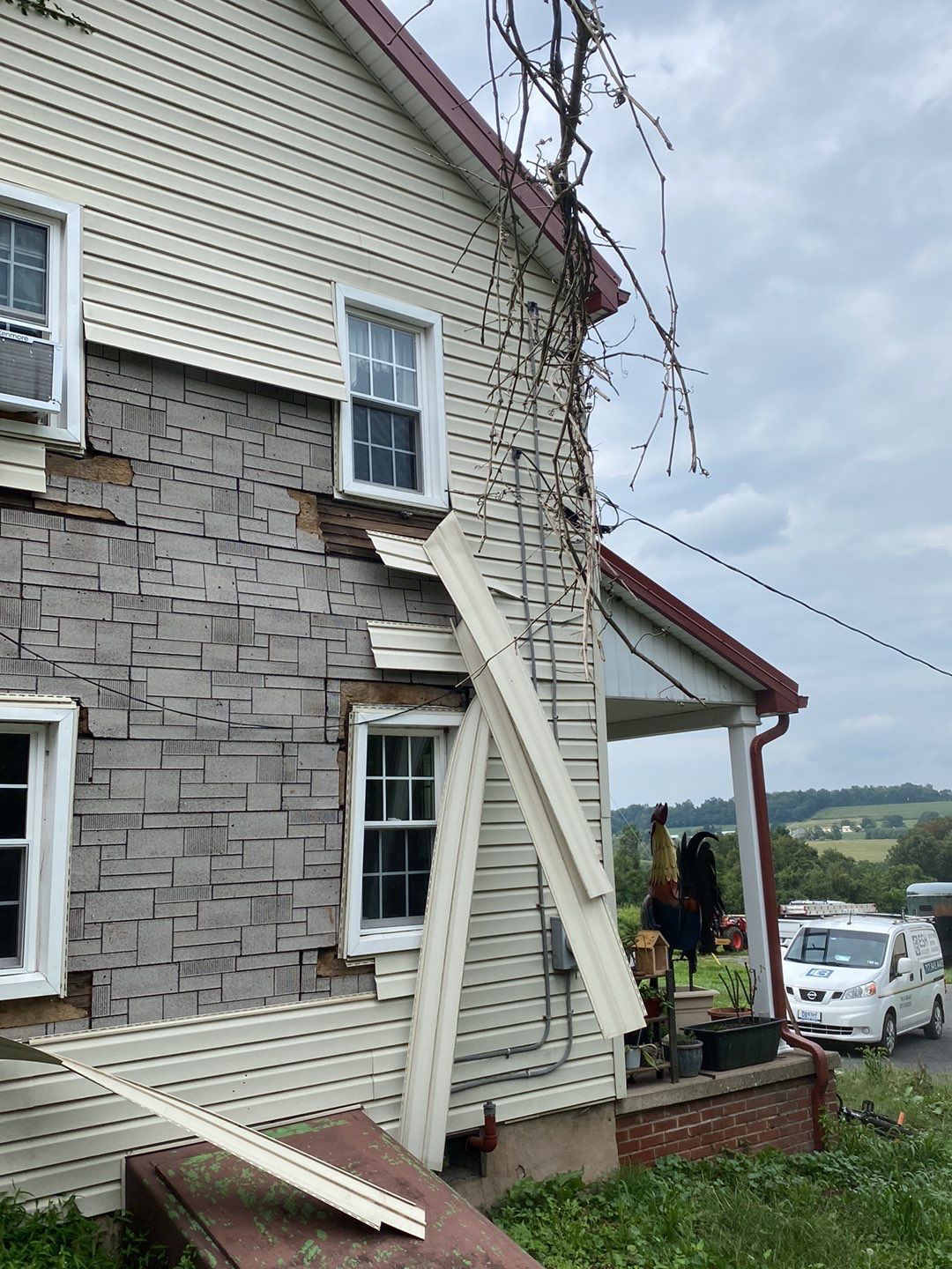 Metal Roof-coloniel red- and new siding by Esh Builders