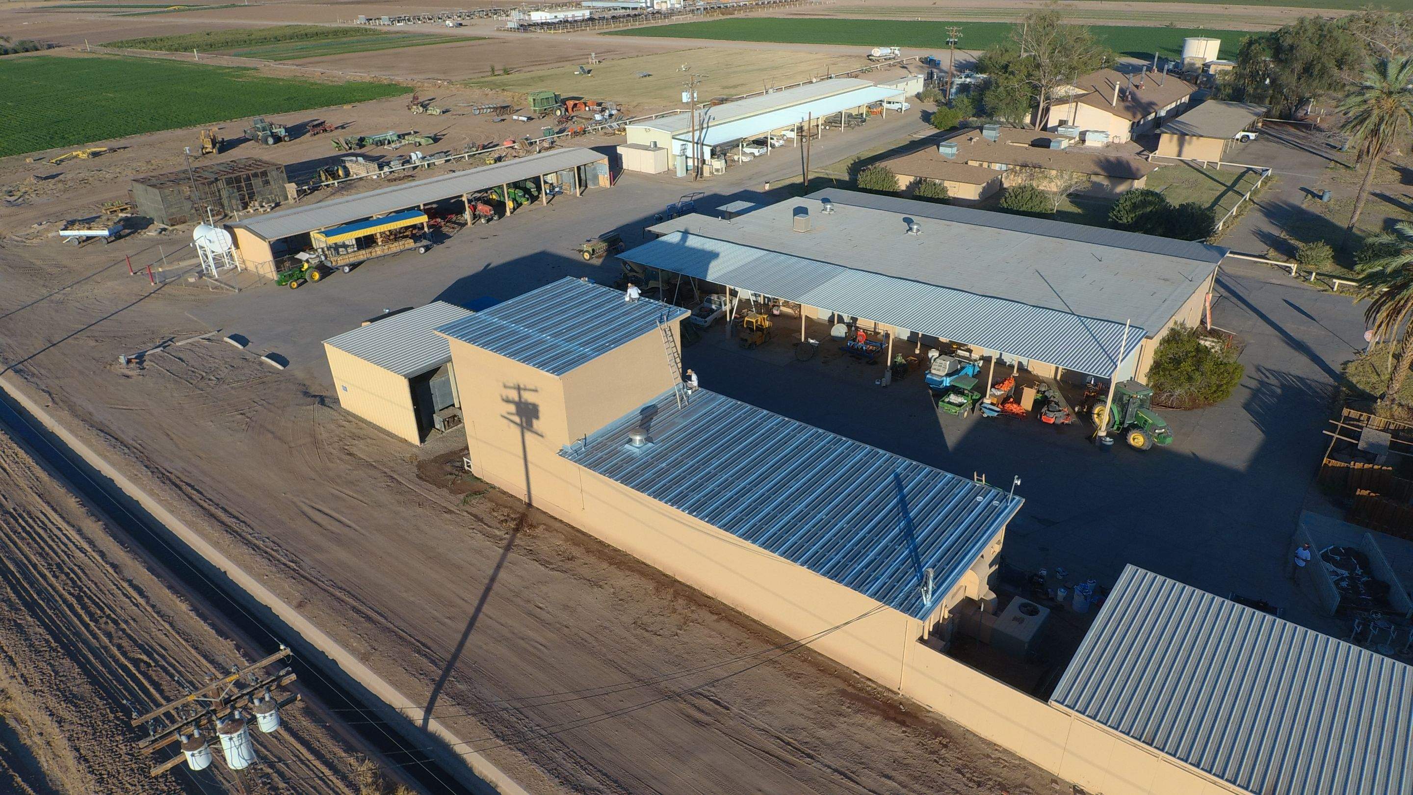 Metal roof restoration on commercial roof using Conklin Benchmark/PUMA XL fabric and coating by Straight Edge Roofing Inc