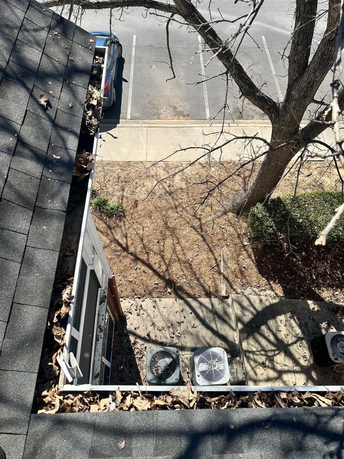 HOA gutter cleaning in Rock Hill, SC, before  photo showing full gutters.