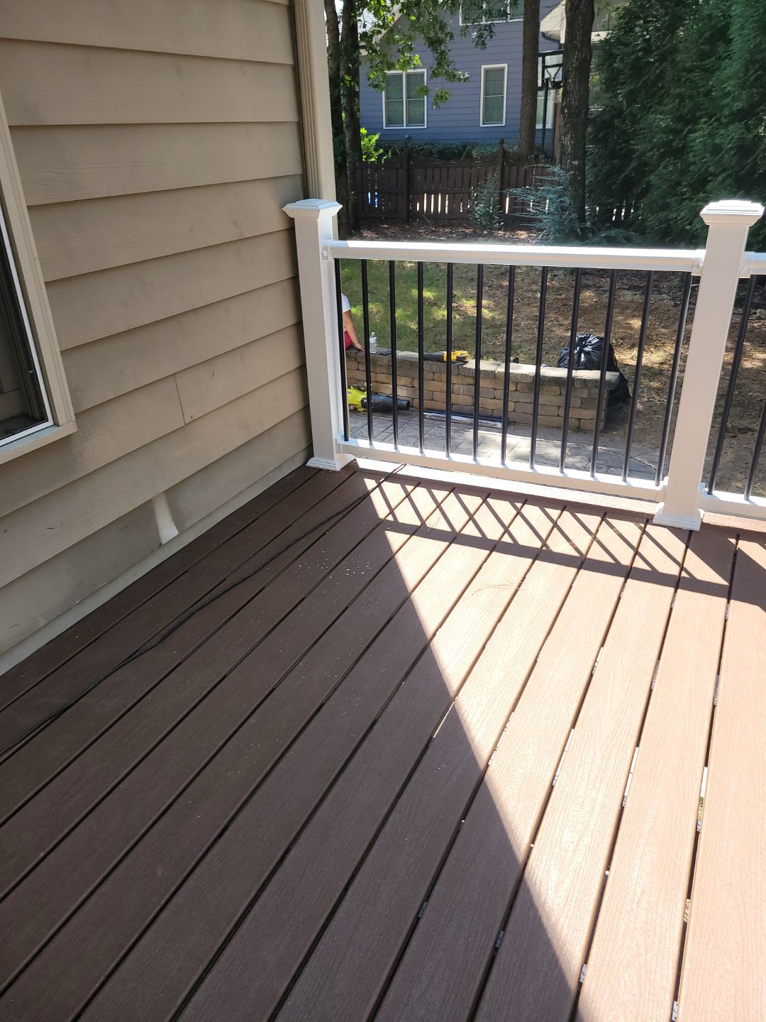 Fuquay-Varina Outdoor Upgrade – Composite Deck & Paved Landing by Elite Remodeling and Design LLC
