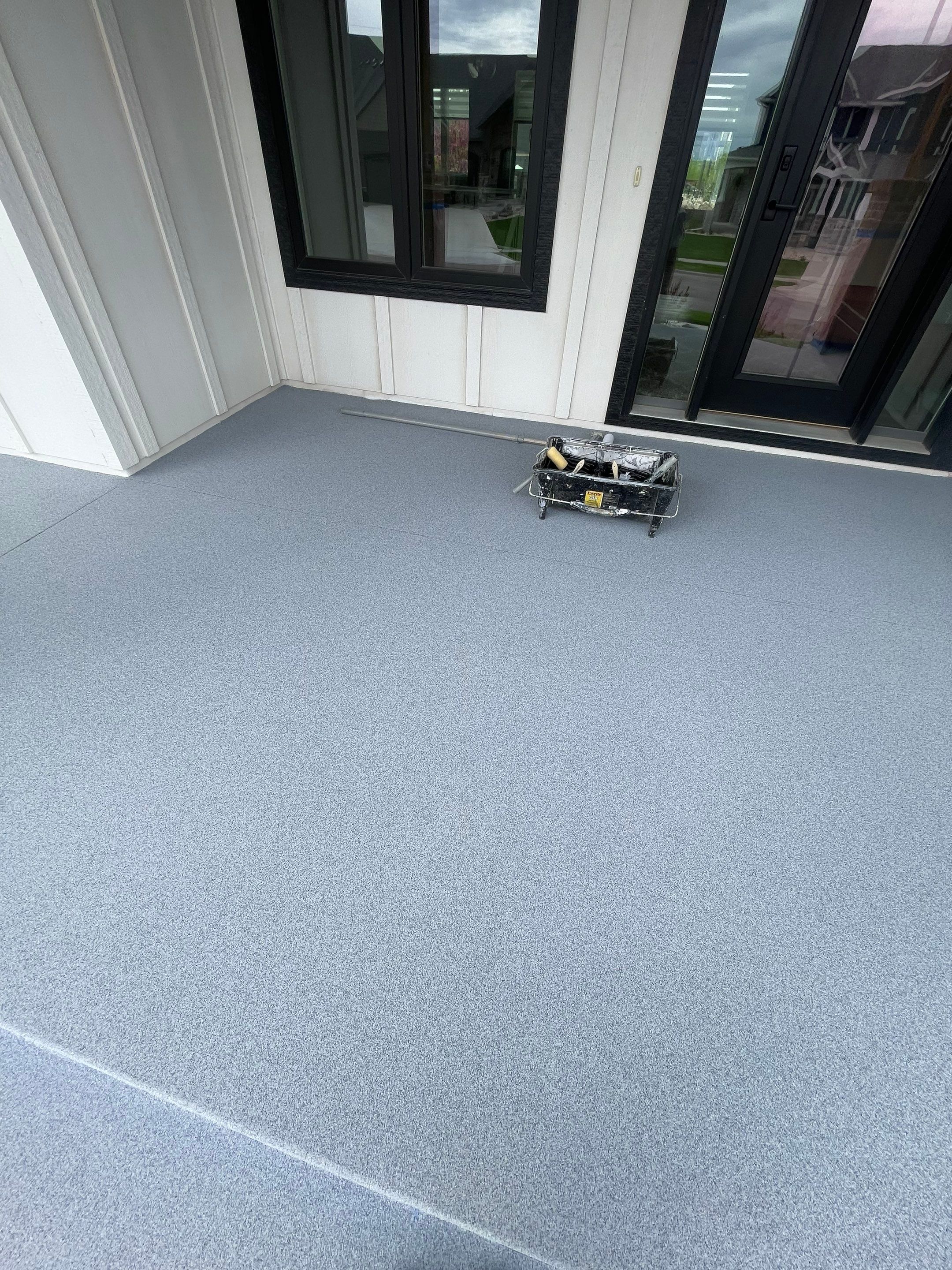 Grey Speckled Concrete Porch Coating for Sioux Falls Home by Select Painting, Coatings & Garage Cabinets
