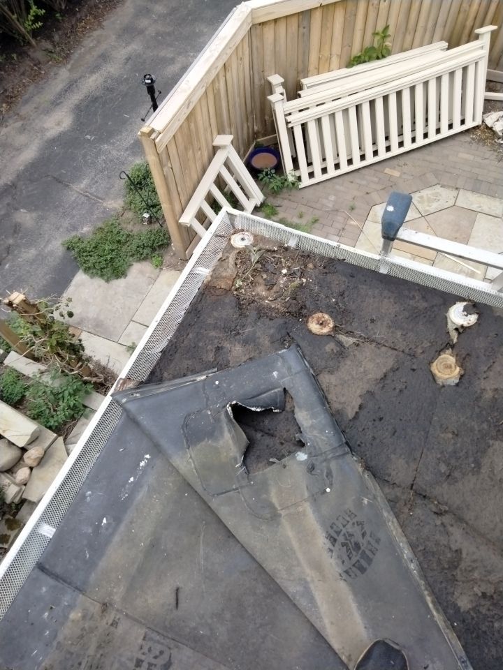 Residential Roofing Installation, Dec-tek walk-out porch roof, siding on garage by Absolute Roofing and Construction
