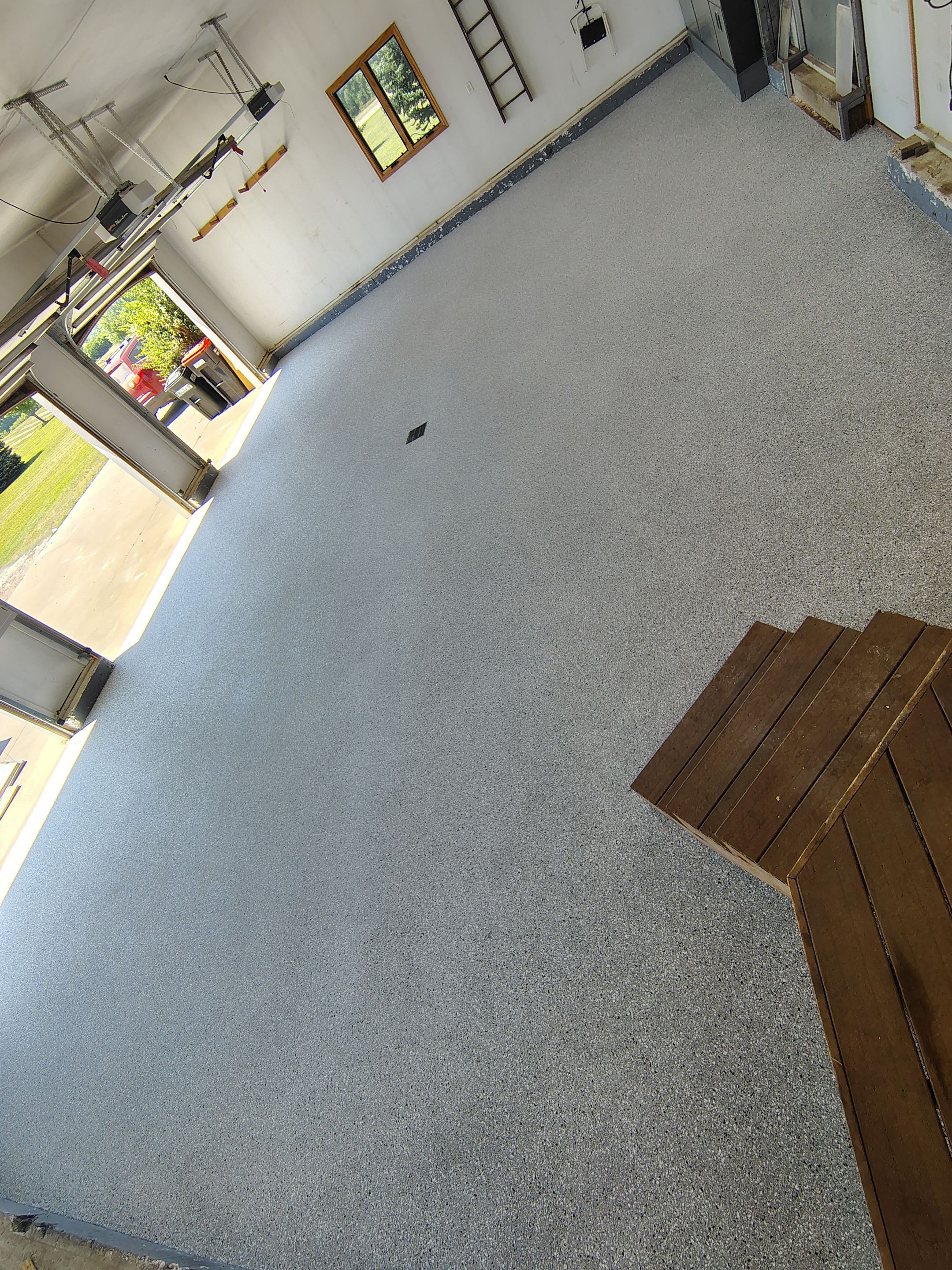 Feather Grey Garage Floor Coating Installation in Valley Springs by Select Painting, Coatings & Garage Cabinets