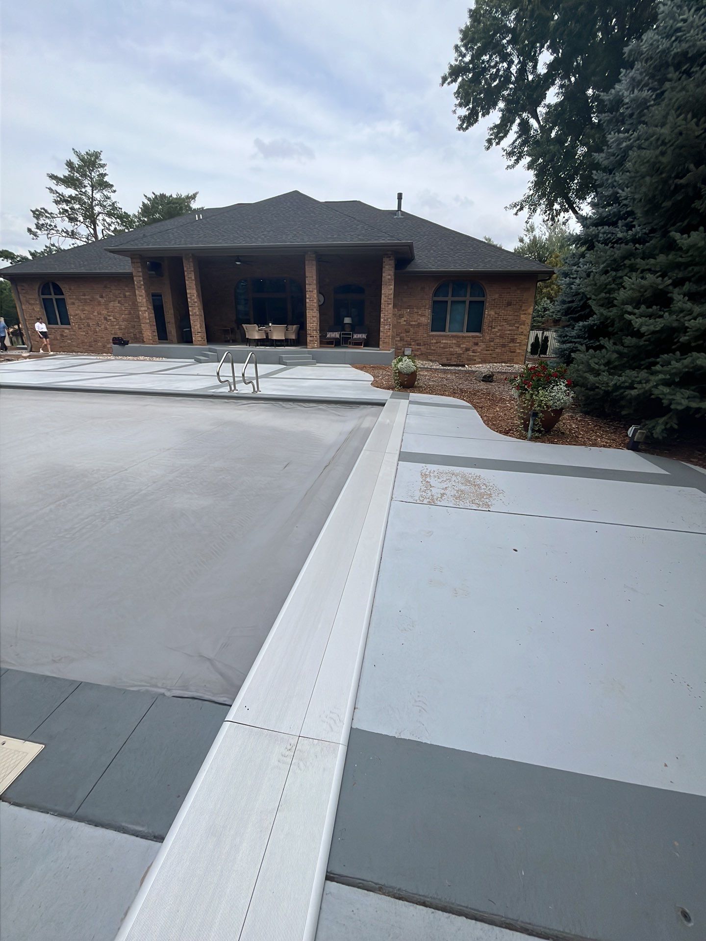 Decorative Concrete Pool Deck and Patio Resurfacing in Sioux Falls by Select Painting, Coatings & Garage Cabinets