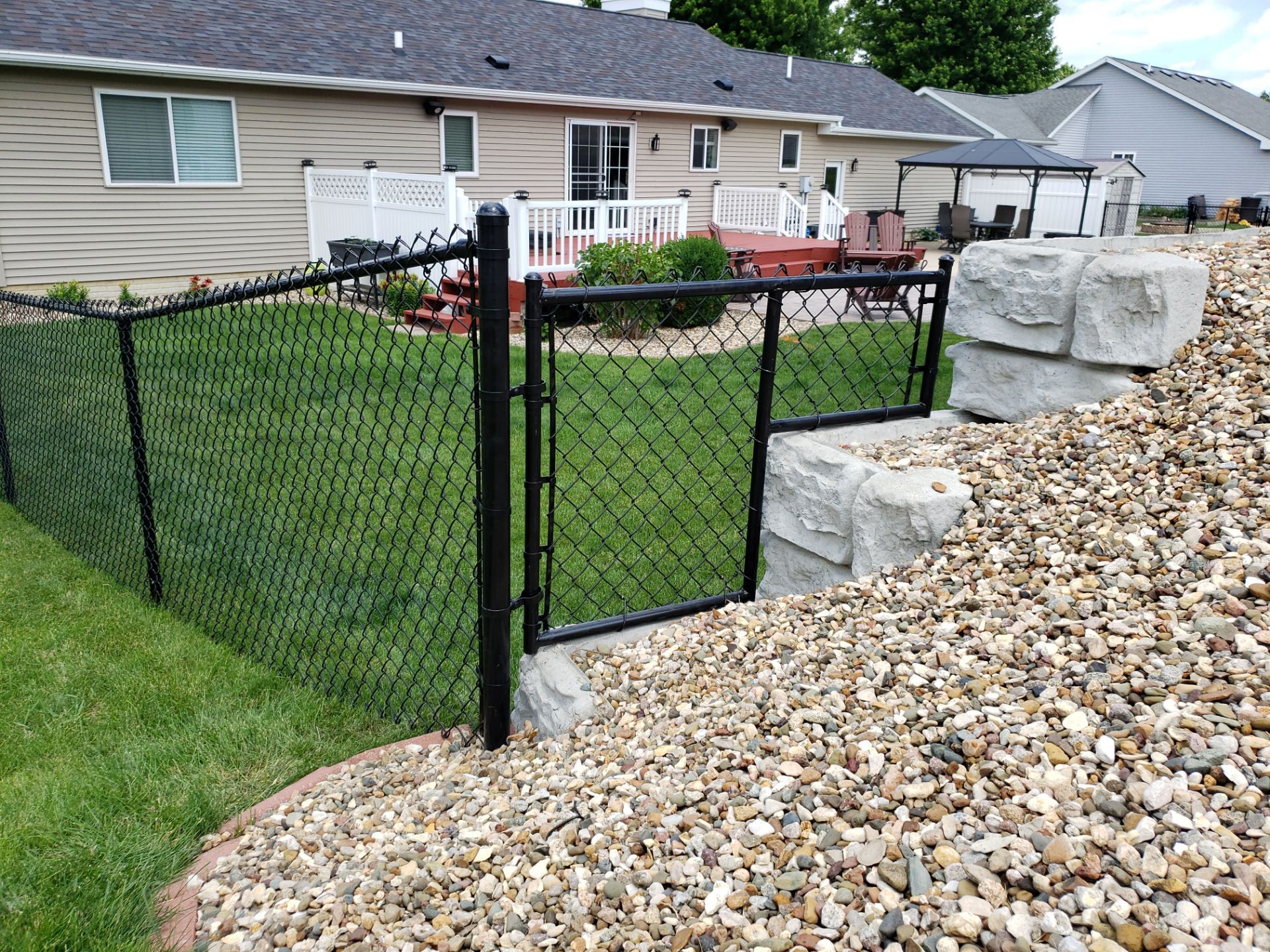 Black Vinyl-Coated Chain Link Fence Installation in Denver by Perfect Picket Fence and Stain