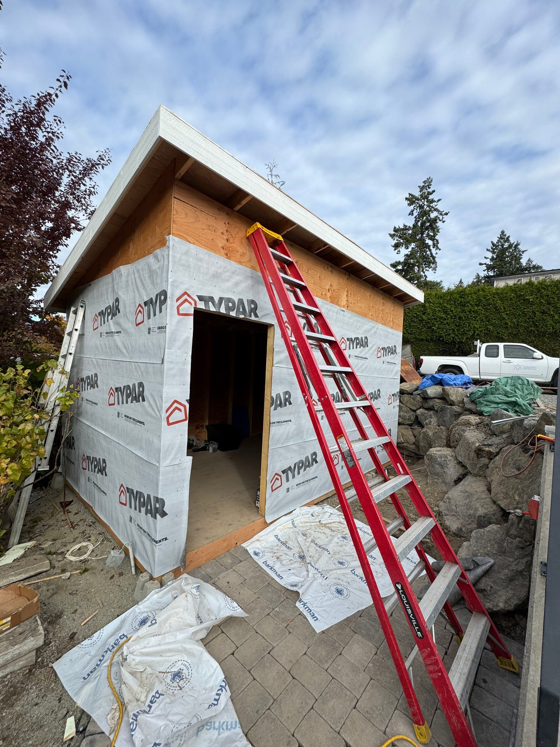 Backyard Transformation — Custom Shed, Paver Patio & Retaining Wall by Habanero Garden and Exterior Care