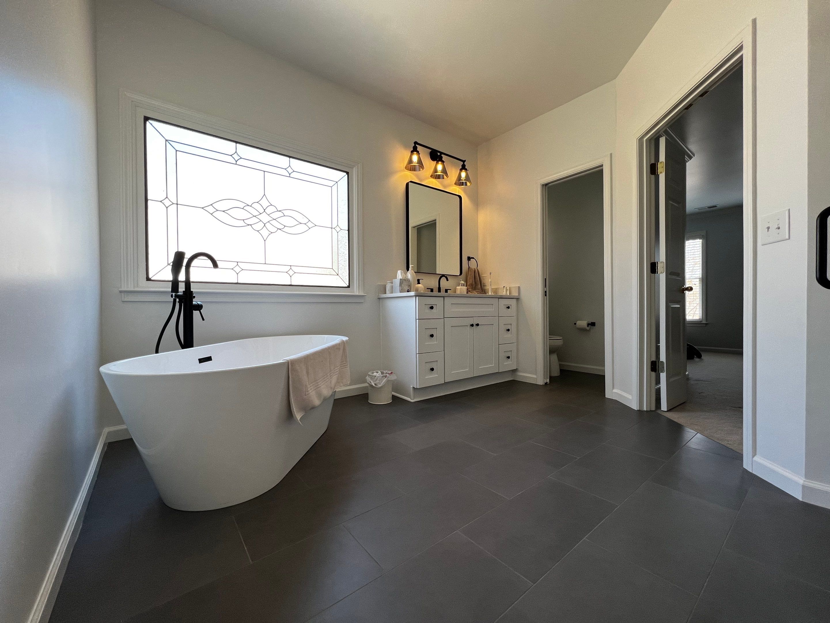 Modern Master Bathroom Remodel and Bedroom Painting in Woodstock by Swift Home Renovations