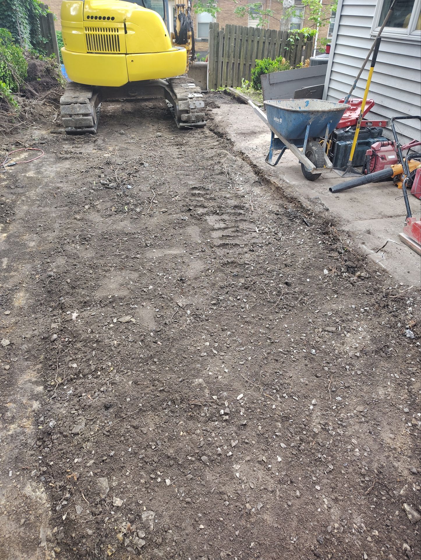 Stamped Concrete and Retaining Wall by Cousins Roofing Siding & Decks