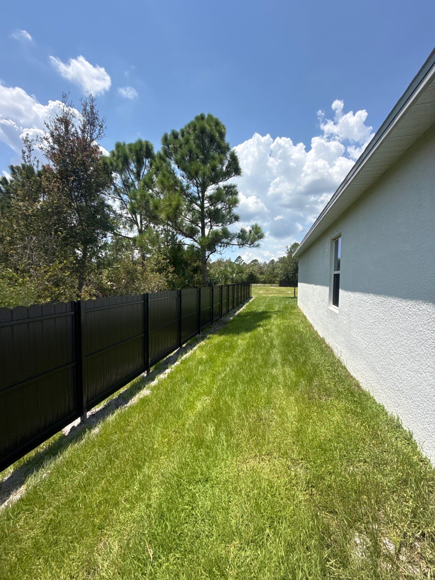 Black Scalloped Metal Privacy Fence Installation in Punta Gorda by True Fence LLC