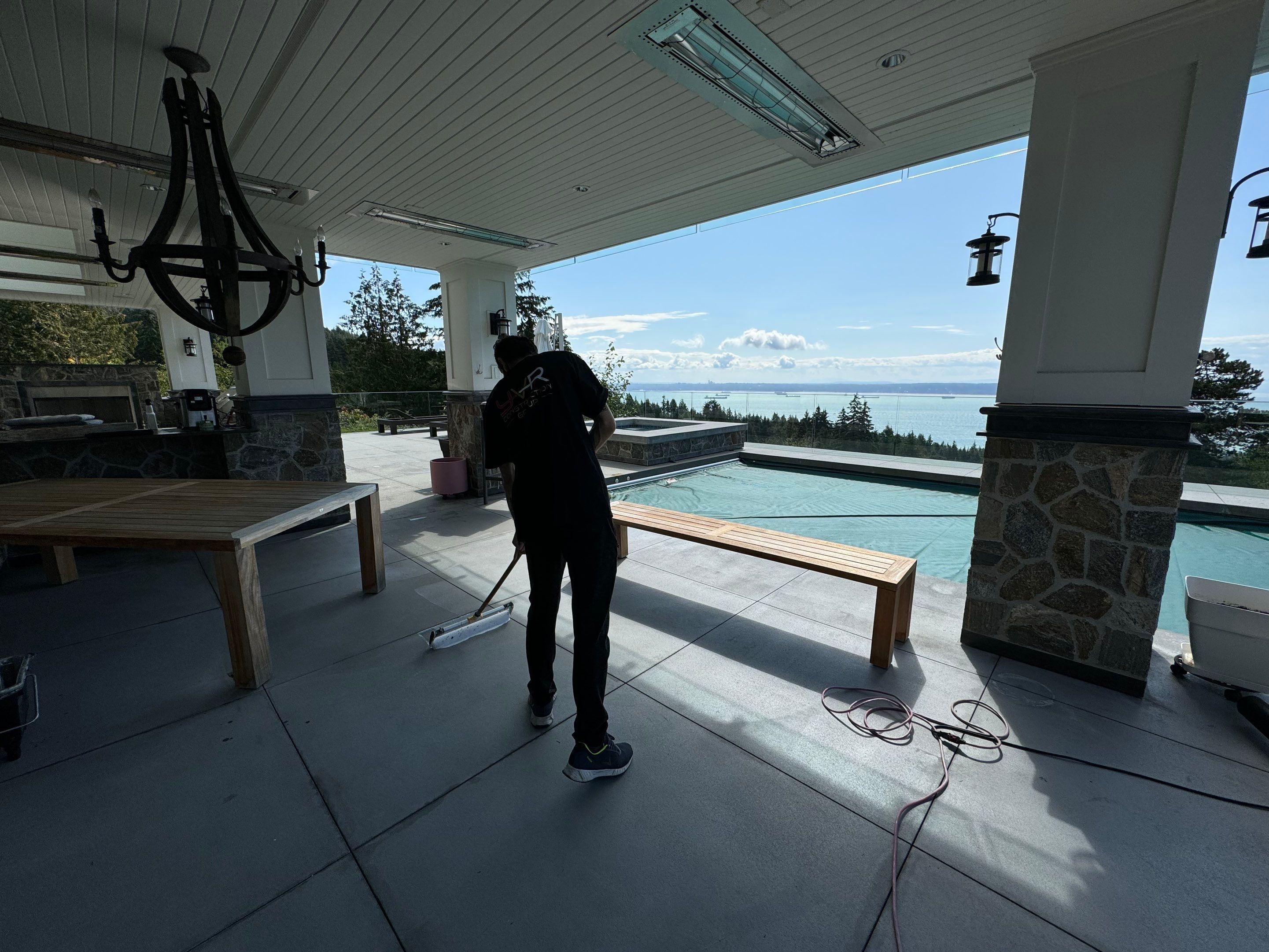 Applying Concrete Sealer  by YVR Construction Group