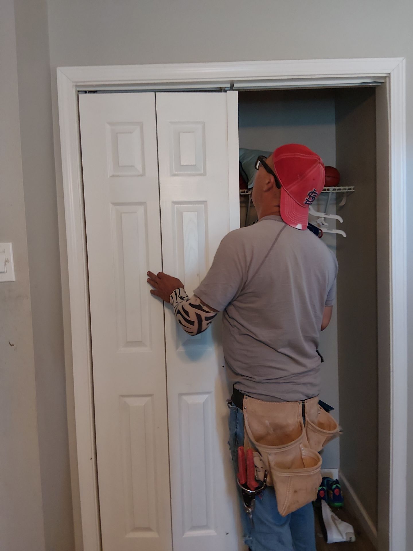 White Paneled Bifold Closet Door Installation by Legendary Services Company LLC.