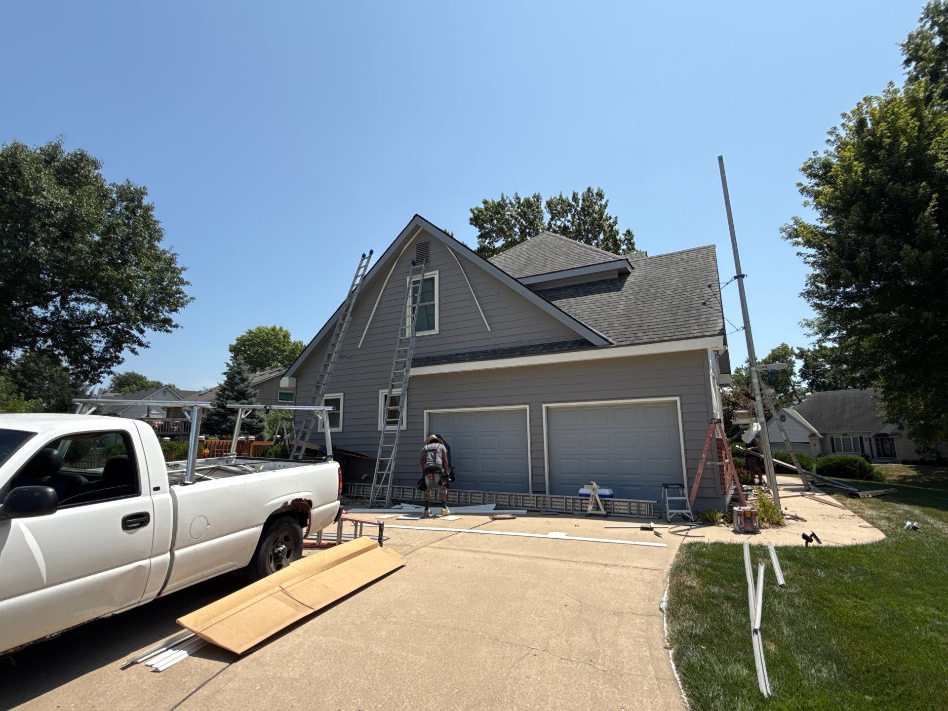 Whole Home Siding Replacement and Gutter Installation in Gladstone by EEC  Windows, Siding & Roofing 