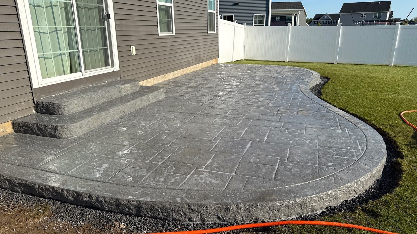 Stamped English Rivenstone Concrete Patio  by NG Masonry & Construction LLC