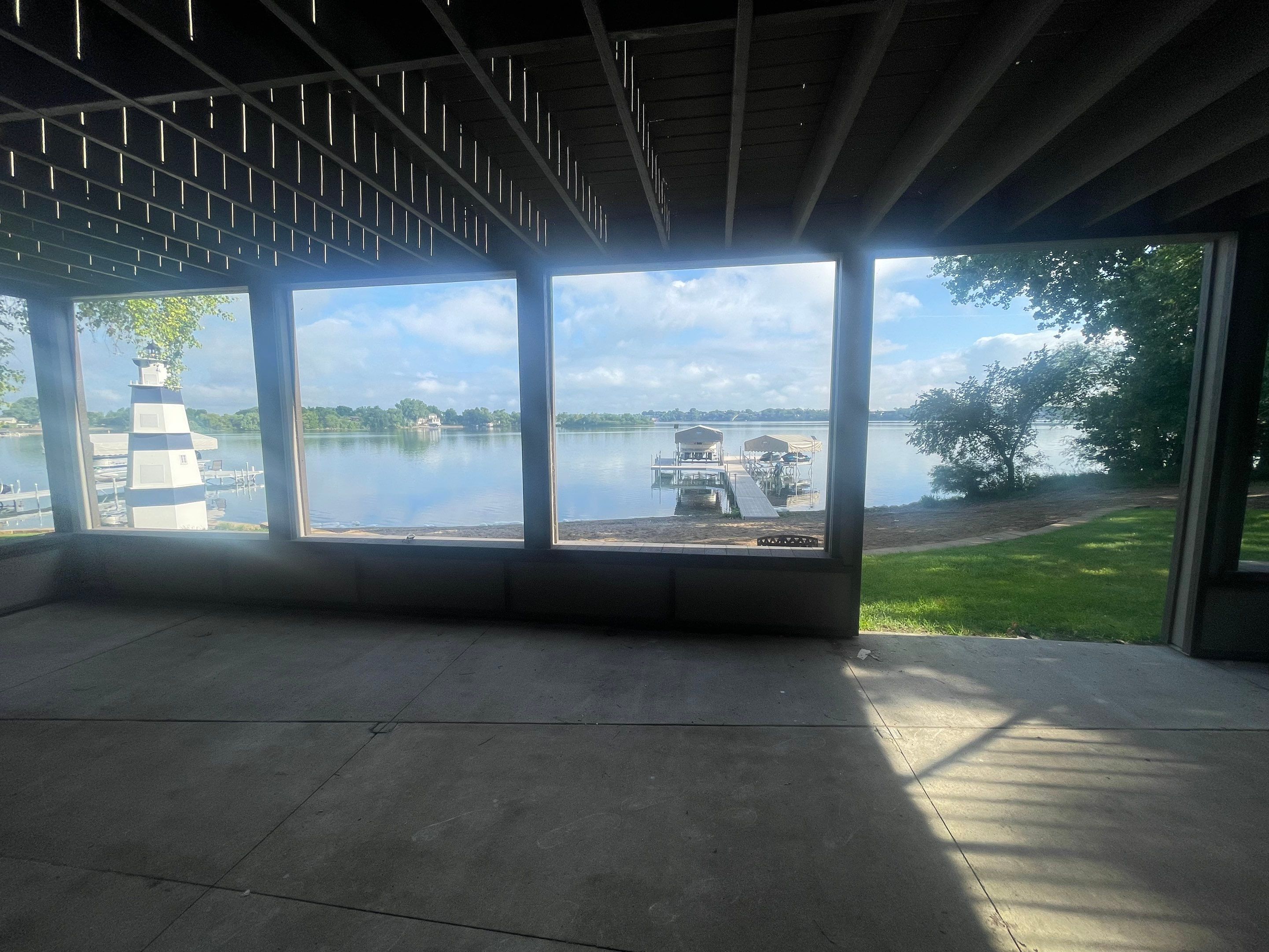 Lakefront Screened Patio Concrete Coating Installation in Wentworth by Select Painting, Coatings & Garage Cabinets