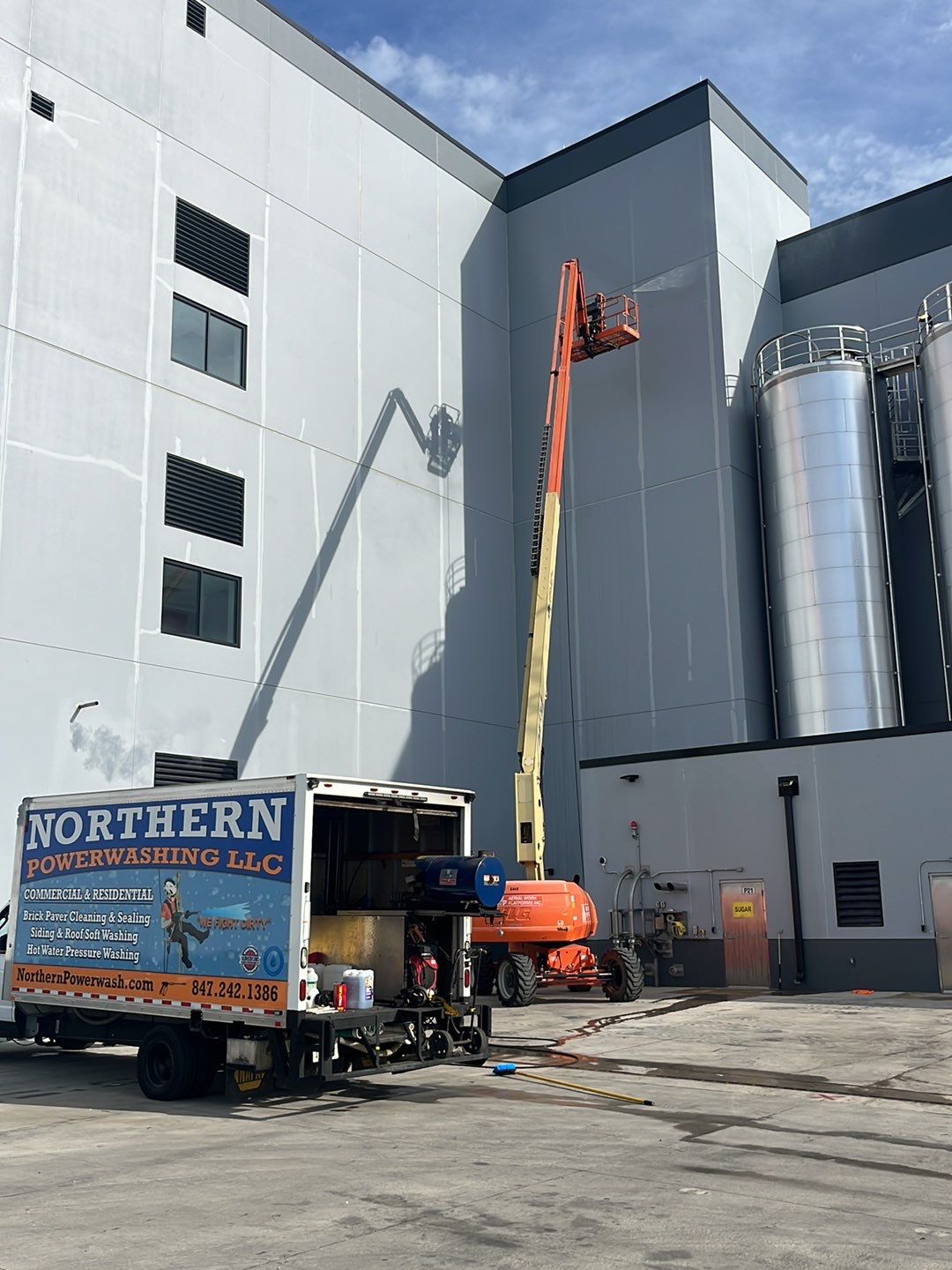 Oil removal using hot water and environmentally friendly degreaser by Northern Power Washing LLC.