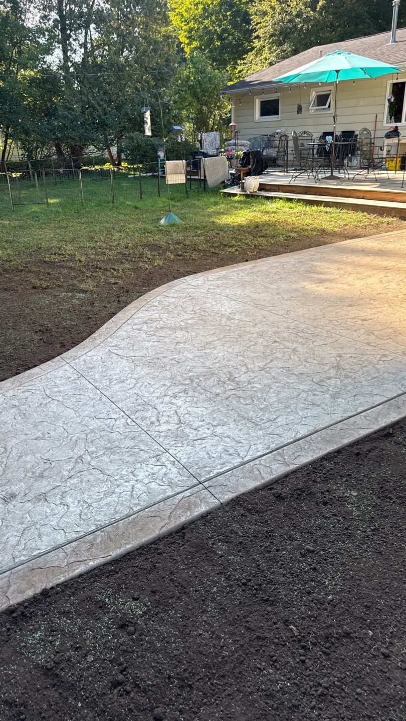 Oxford slate stamped patio  by NG Masonry & Construction LLC