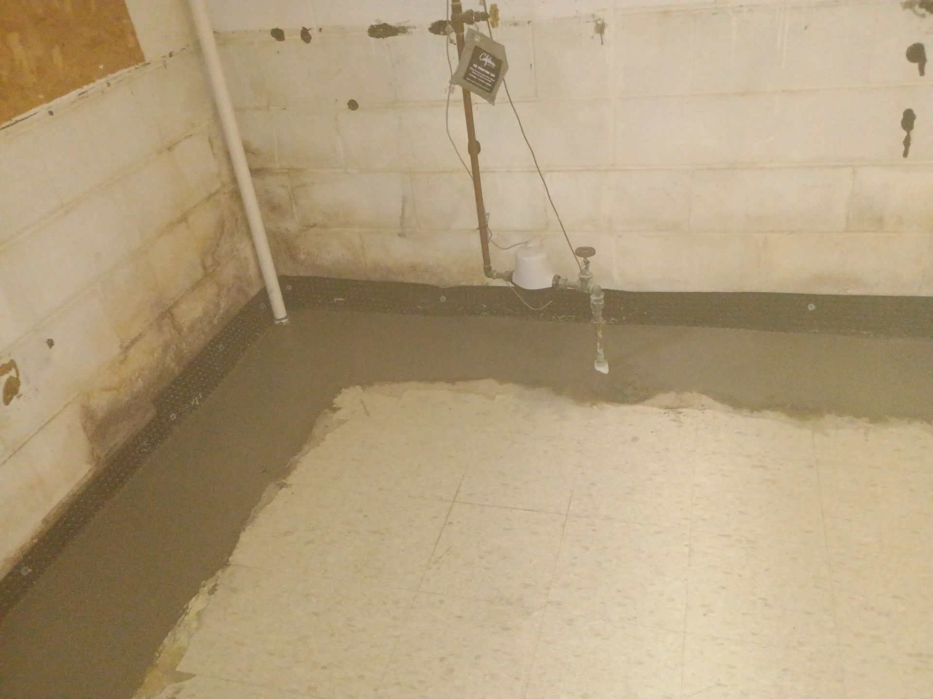 Interior Drain Tile Installation in Columbia Heights, MN by Waterproofing Northeast