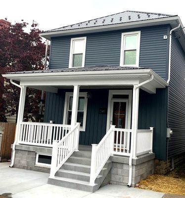 Charcoal Metal Roof & Blue Siding — A Refreshing New Look