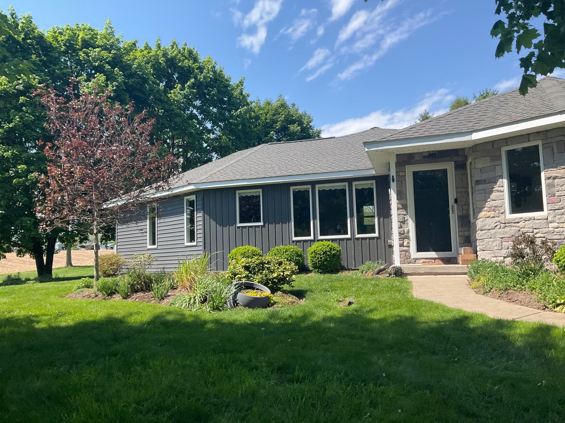 Nightfall Exterior Siding Replacement and Stone Veneer in Halifax by Esh Builders