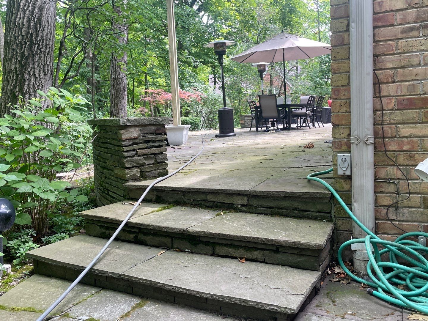 Bluestone patio cleaning by Northern Power Washing LLC.