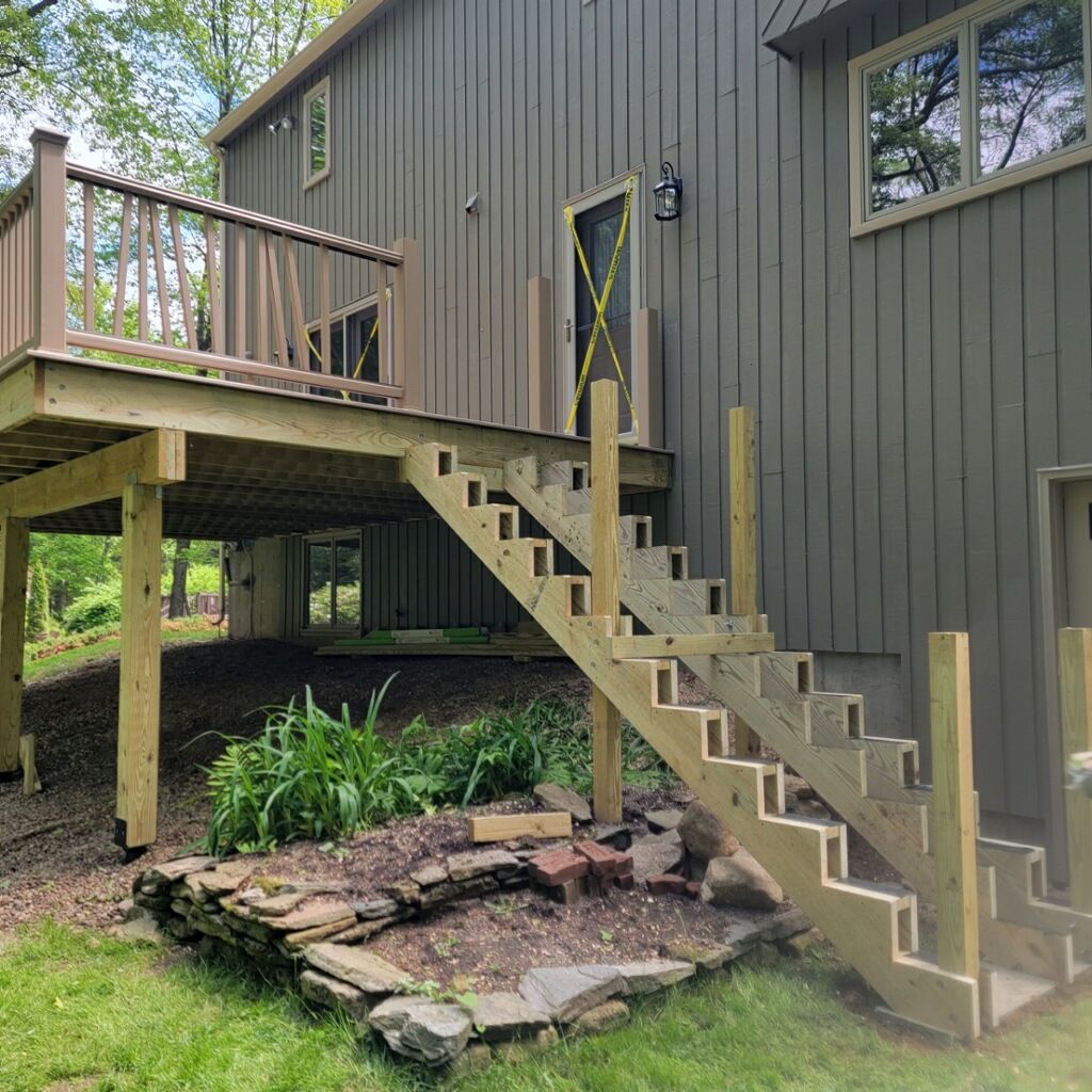 Deck Replacement using Trex Transcend Rope Swing and matching Transcend railings and trex fascia by DiGiorgi Roofing and Siding Inc