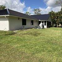 24ga 1.5" Mechanical Seam Dark Bronze by Total Roofing System The Metal Roof Experts