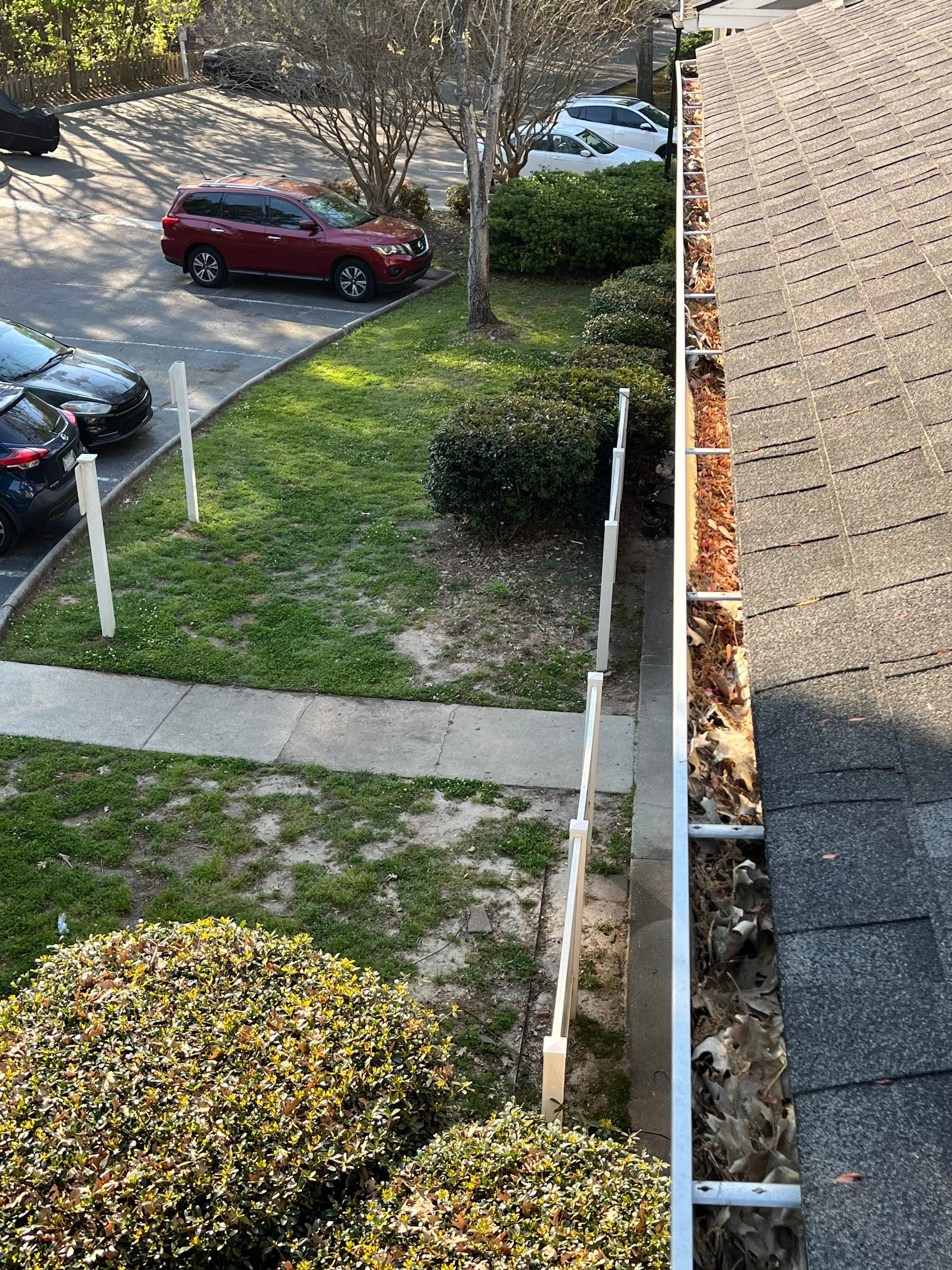 Commercial gutter cleaning Georgia before photo with filled gutters