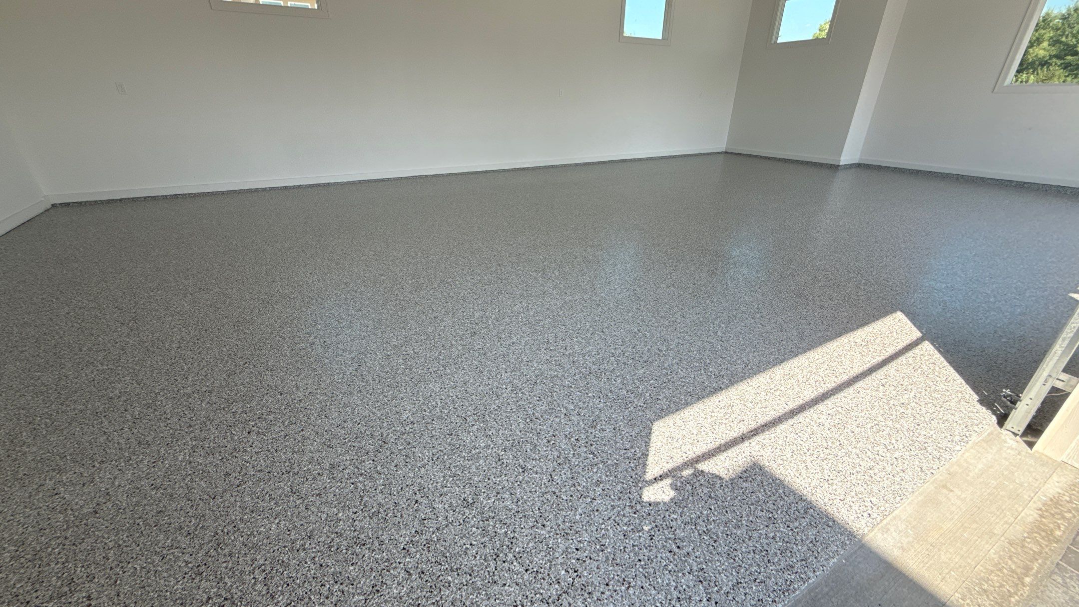 Custom Garage Epoxy Flake Floor Coating in Leawood by Banner Garage