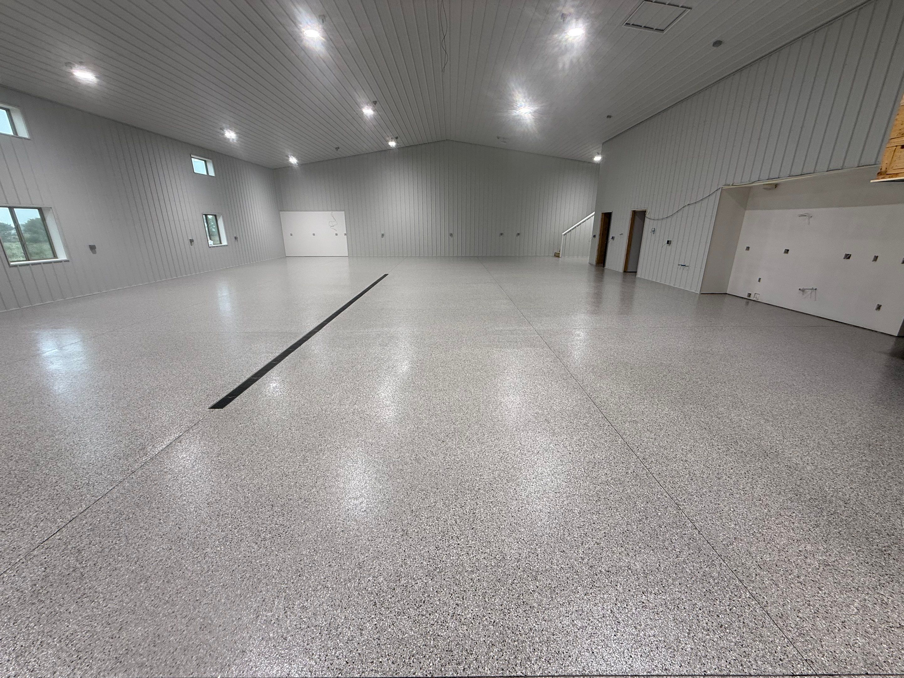 Custom Speckled Floor Coating for Large Montrose Shop by Select Painting, Coatings & Garage Cabinets