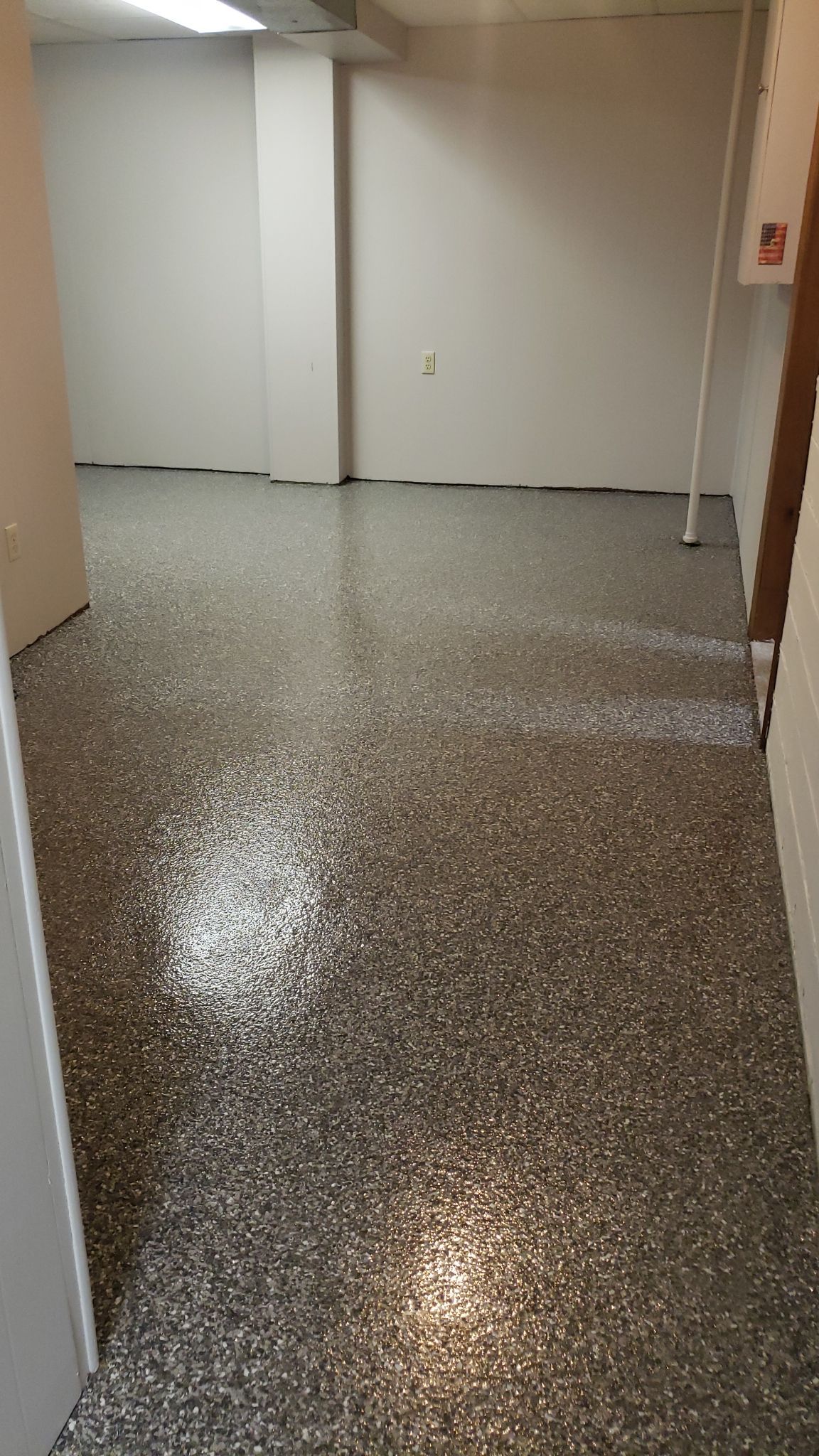 A Revitalized Basement by Revival Concrete Coatings, LLC