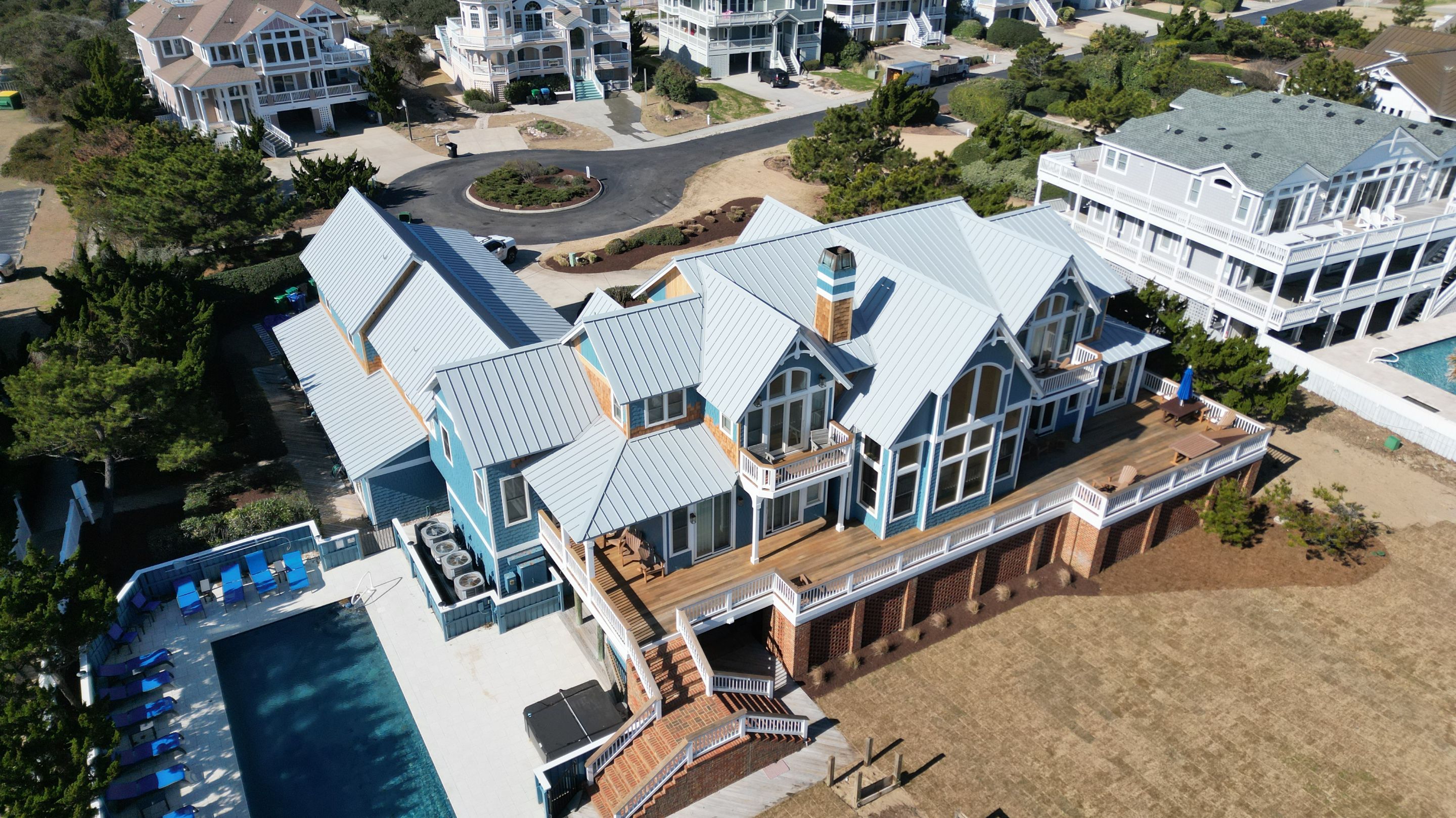 Large Metal Roof Transformation by Gallop Roofing & Remodeling, Inc.